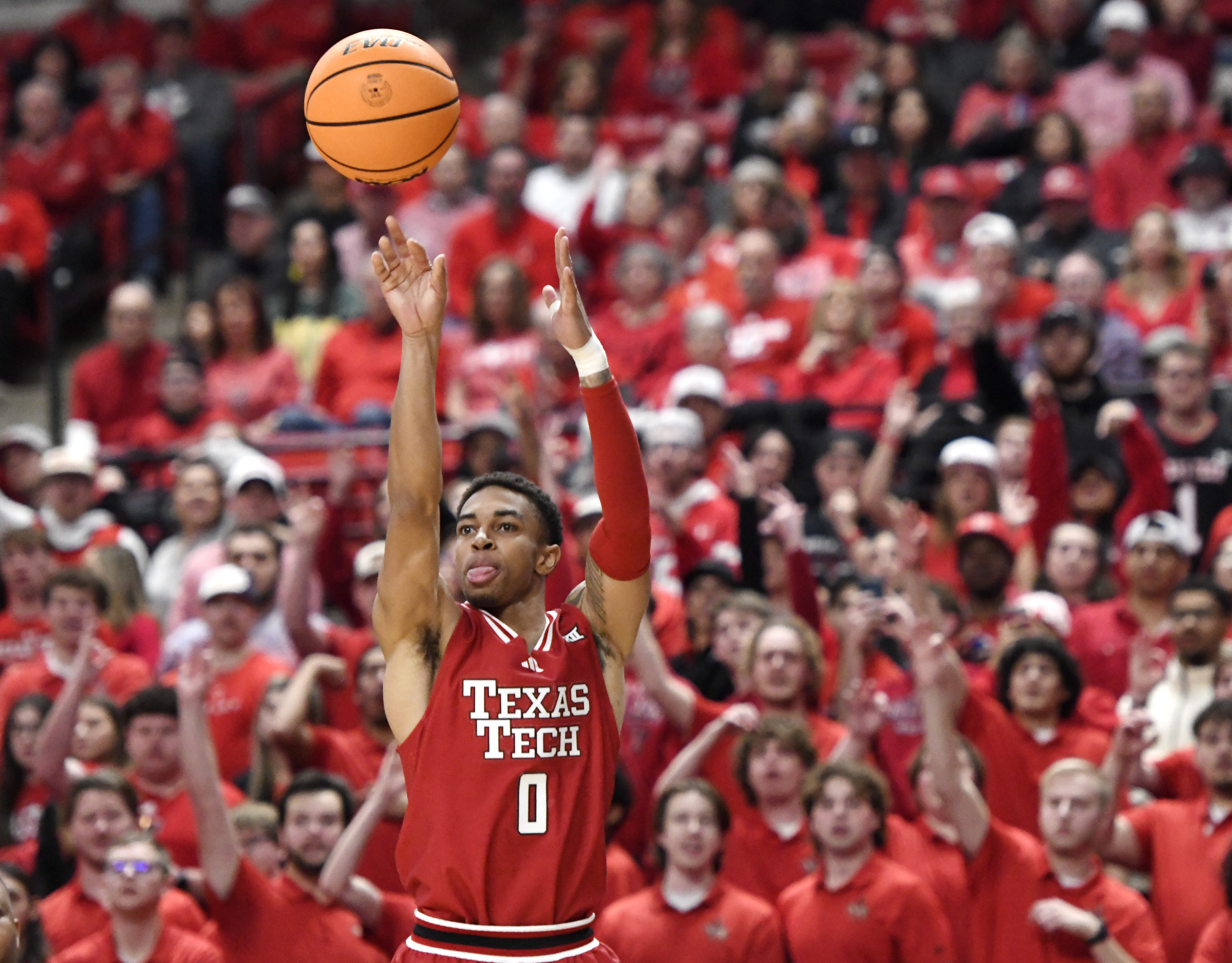 Texas Tech guard Chance McMillian (0) shoots a 3-pointer during the first half of an NCAA college basketball game against Baylor, Tuesday, Feb. 4, 2025, in Lubbock, Texas.