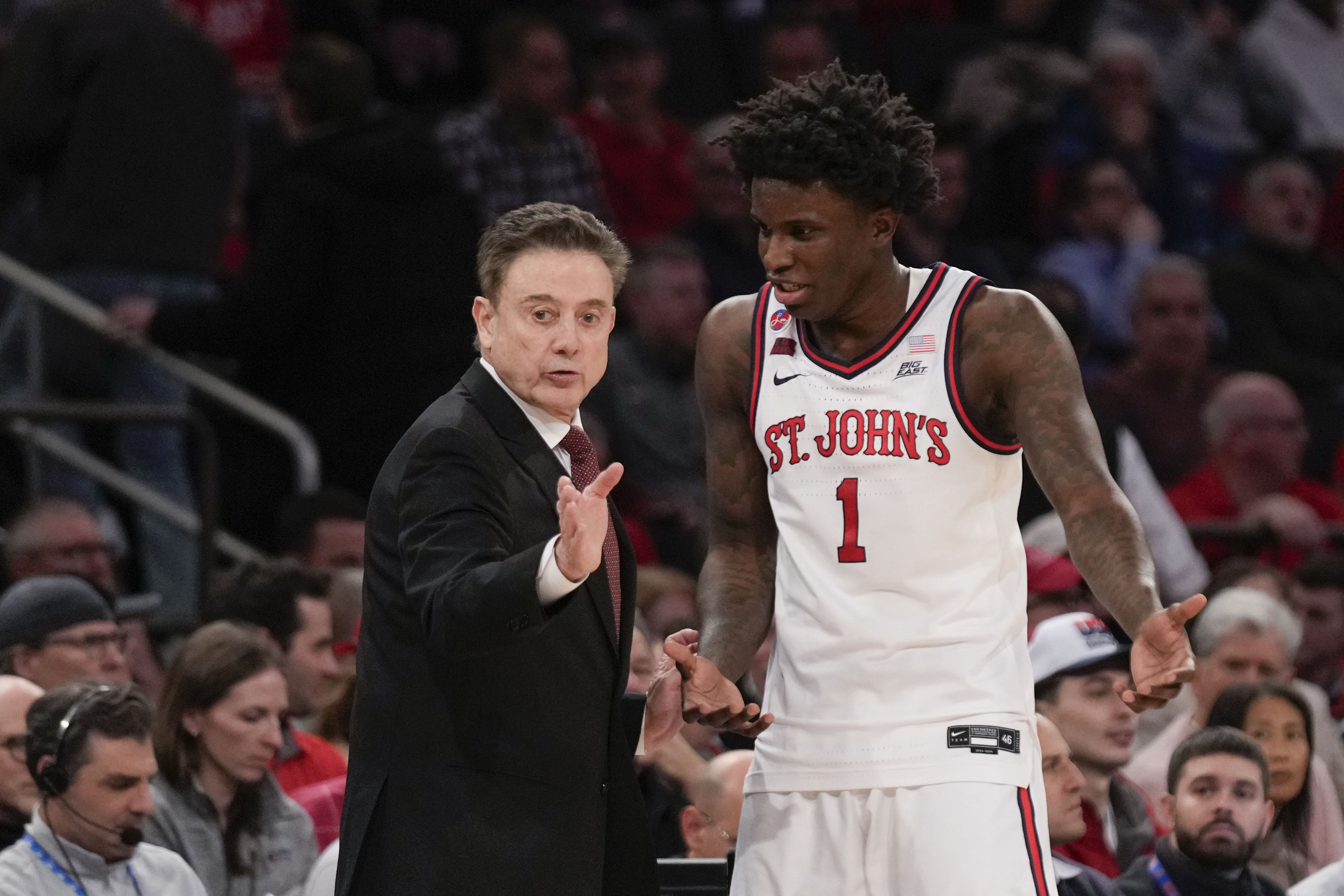 St. John's head coach Rick Pitino, left, talks with Kadary Richmond during the first half of an NCAA college basketball game against Marquette, Tuesday, Feb. 4, 2025, in New York.