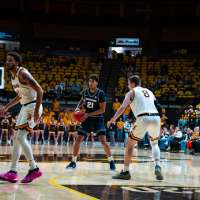 Utah State uses strong 2nd half to hold off Wyoming 71-67