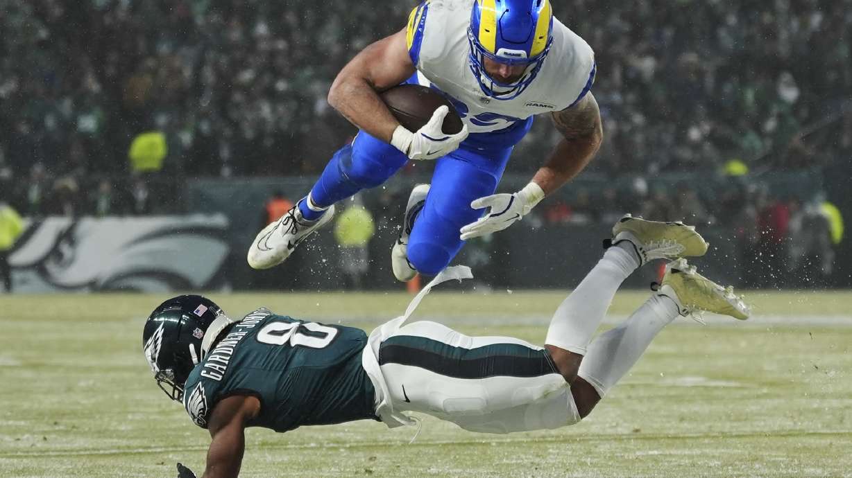 Los Angeles Rams tight end Tyler Higbee (89) is stopped by Philadelphia Eagles safety C.J. Gardner-Johnson (8) during the second half of an NFL football NFC divisional playoff game Sunday, Jan. 19, 2025, in Philadelphia.