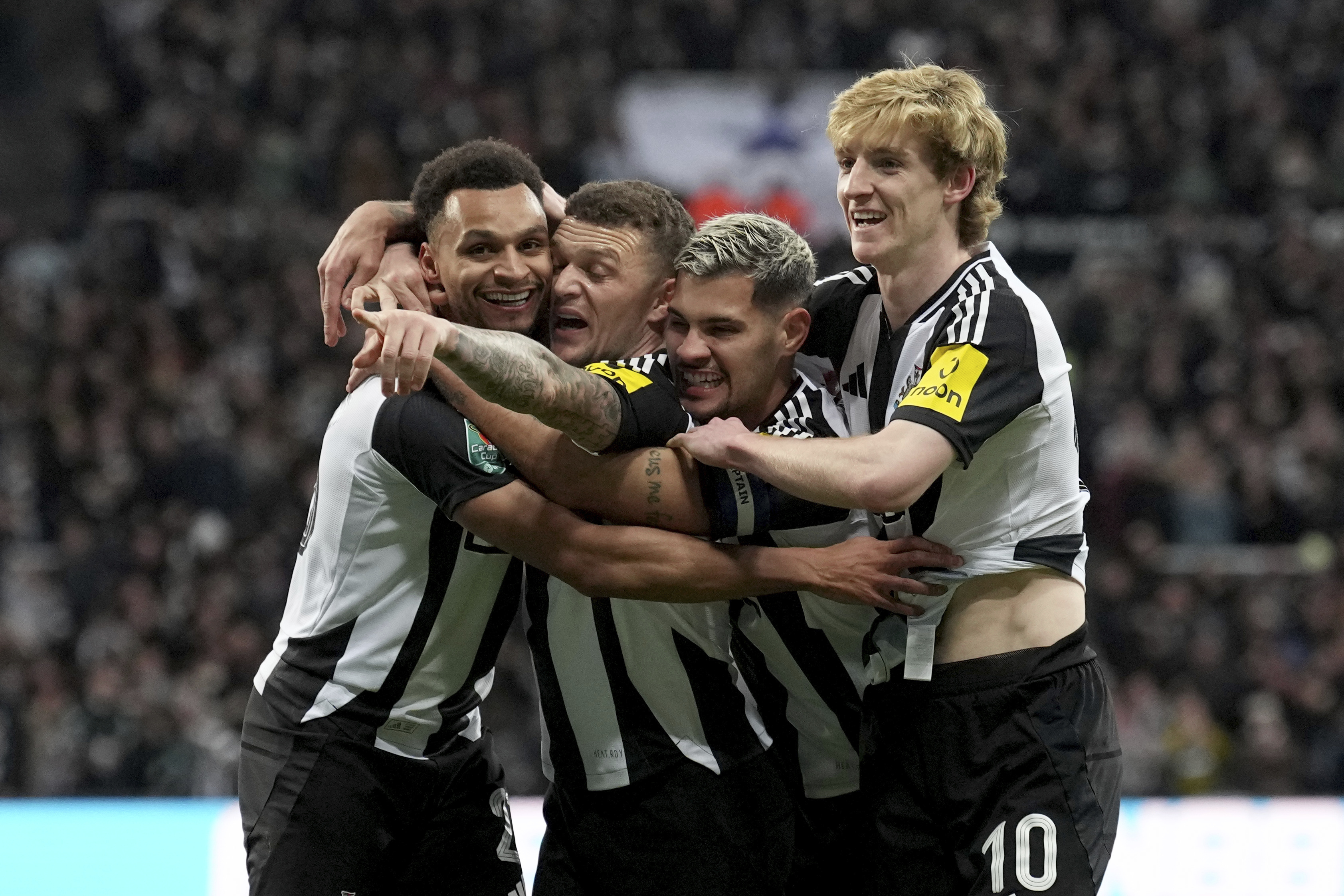 Newcastle's Jacob Murphy, left, celebrates with teammates scoring his side's first goal during the English League Cup soccer match between Newcastle United and Arsenal at St. James' Park stadium in Newcastle, England, Wednesday, Feb. 5, 2025.