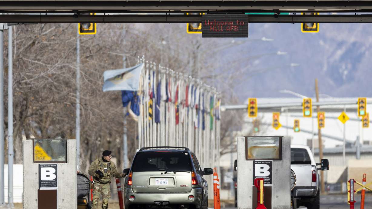 A guard at the south gate of Hill Air Force Base northeast of Clearfield on Dec. 11, 2024. Government and contract civilian workers with telework or hybrid arrangements have been ordered to return to the office full time, starting Thursday.