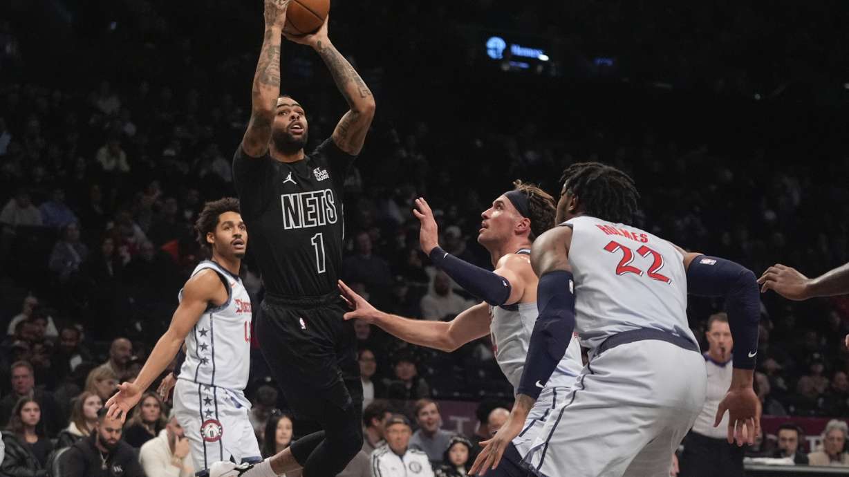 Brooklyn Nets' D'Angelo Russell (1) shoots over Washington Wizards' Richaun Holmes (22) during the first half of an NBA basketball game Wednesday, Feb. 5, 2025, in New York.