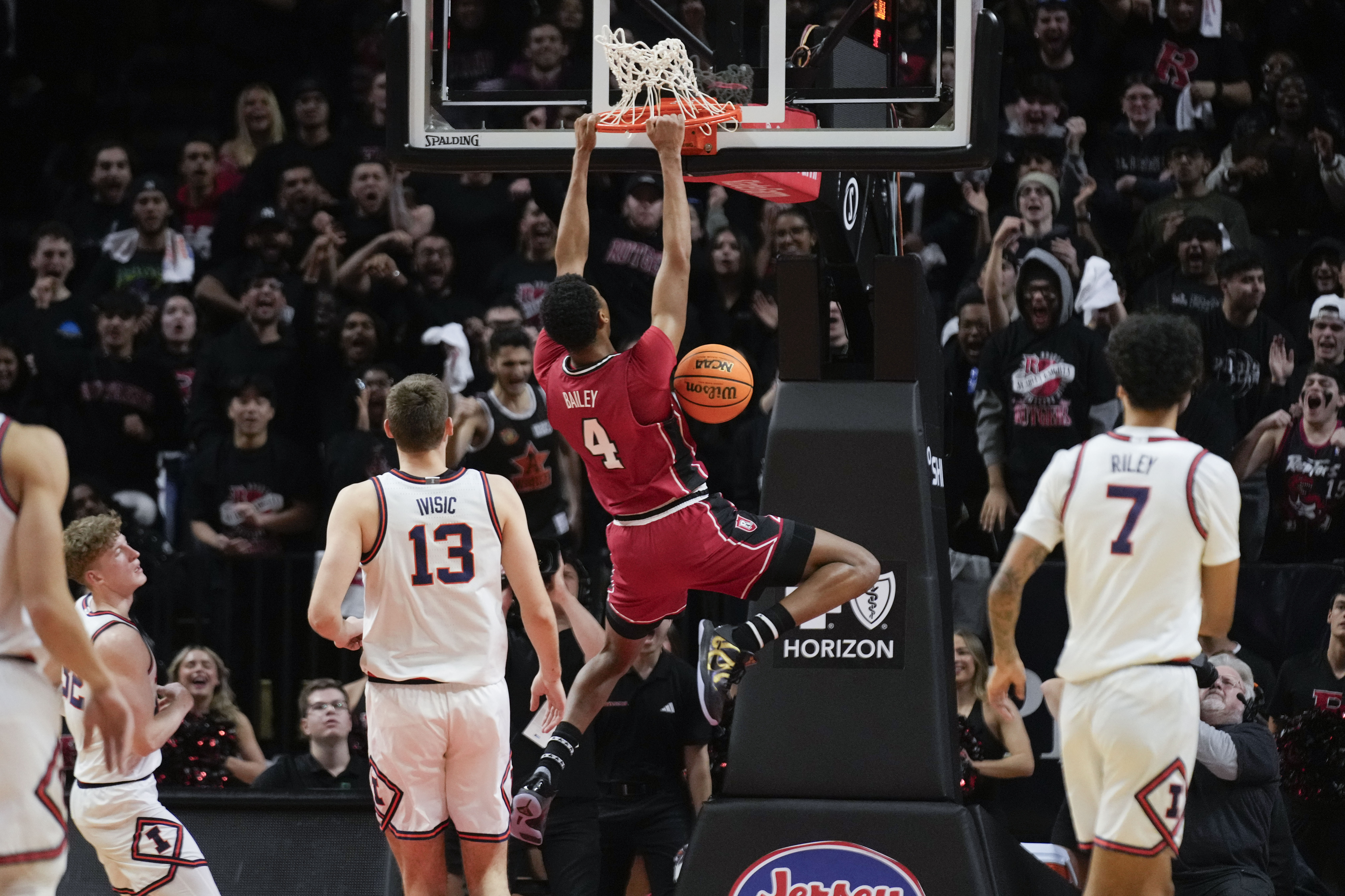 Rutgers' Ace Bailey (4) dunks the ball during the first half of an NCAA college basketball game against Illinois, Wednesday, Feb. 5, 2025, in New York. 