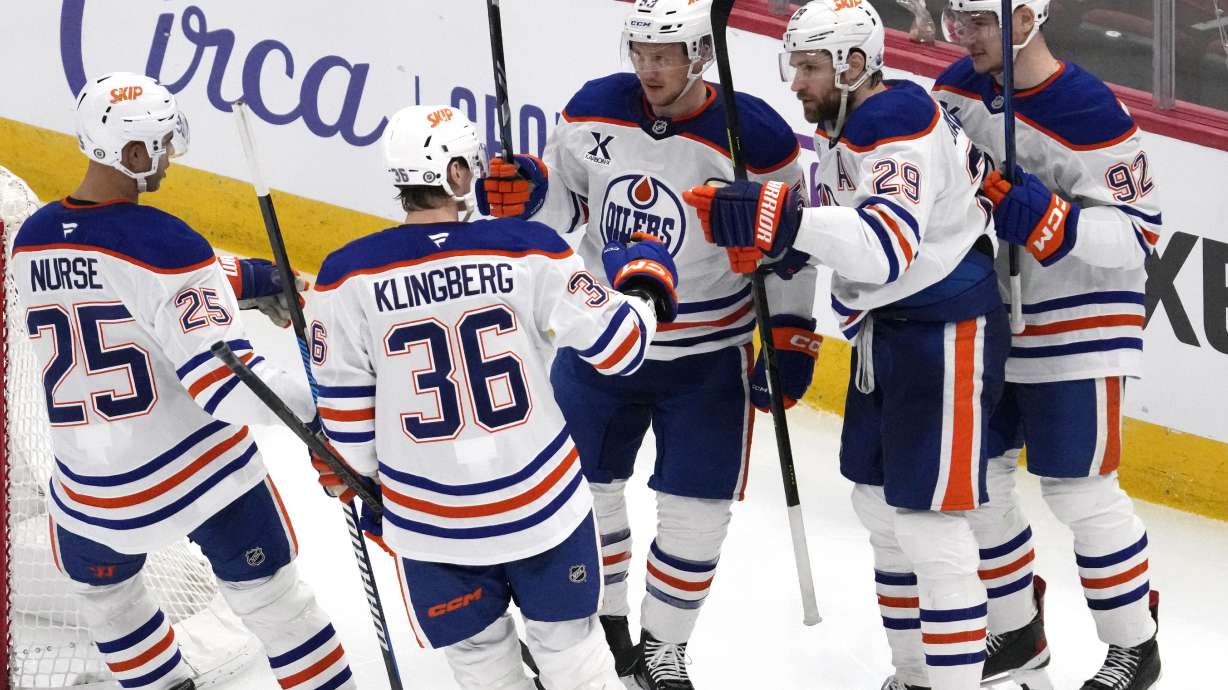Edmonton Oilers center Jeff Skinner, center, celebrates with teammates after scoring a goal during the third period of an NHL hockey game against the Chicago Blackhawks in Chicago, Wednesday, Feb. 5, 2025.