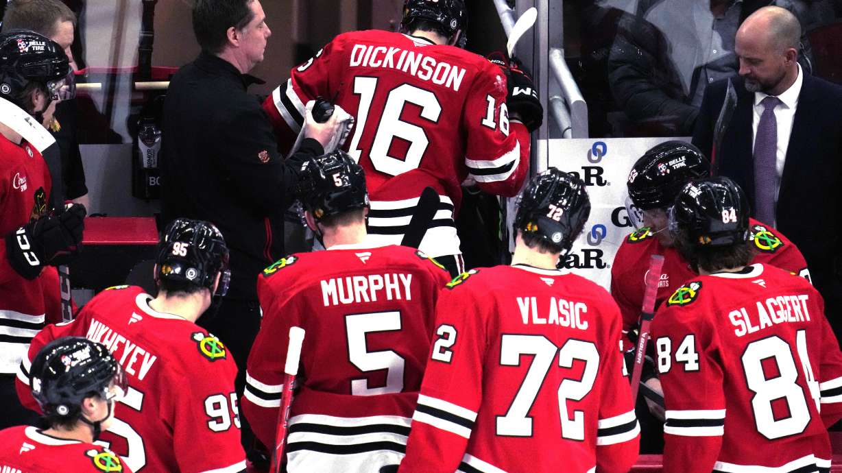 Chicago Blackhawks center Jason Dickinson (16) leaves the ice toward the team's dressing room after an injury during the second period of an NHL hockey game against the Edmonton Oilers in Chicago, Wednesday, Feb. 5, 2025.