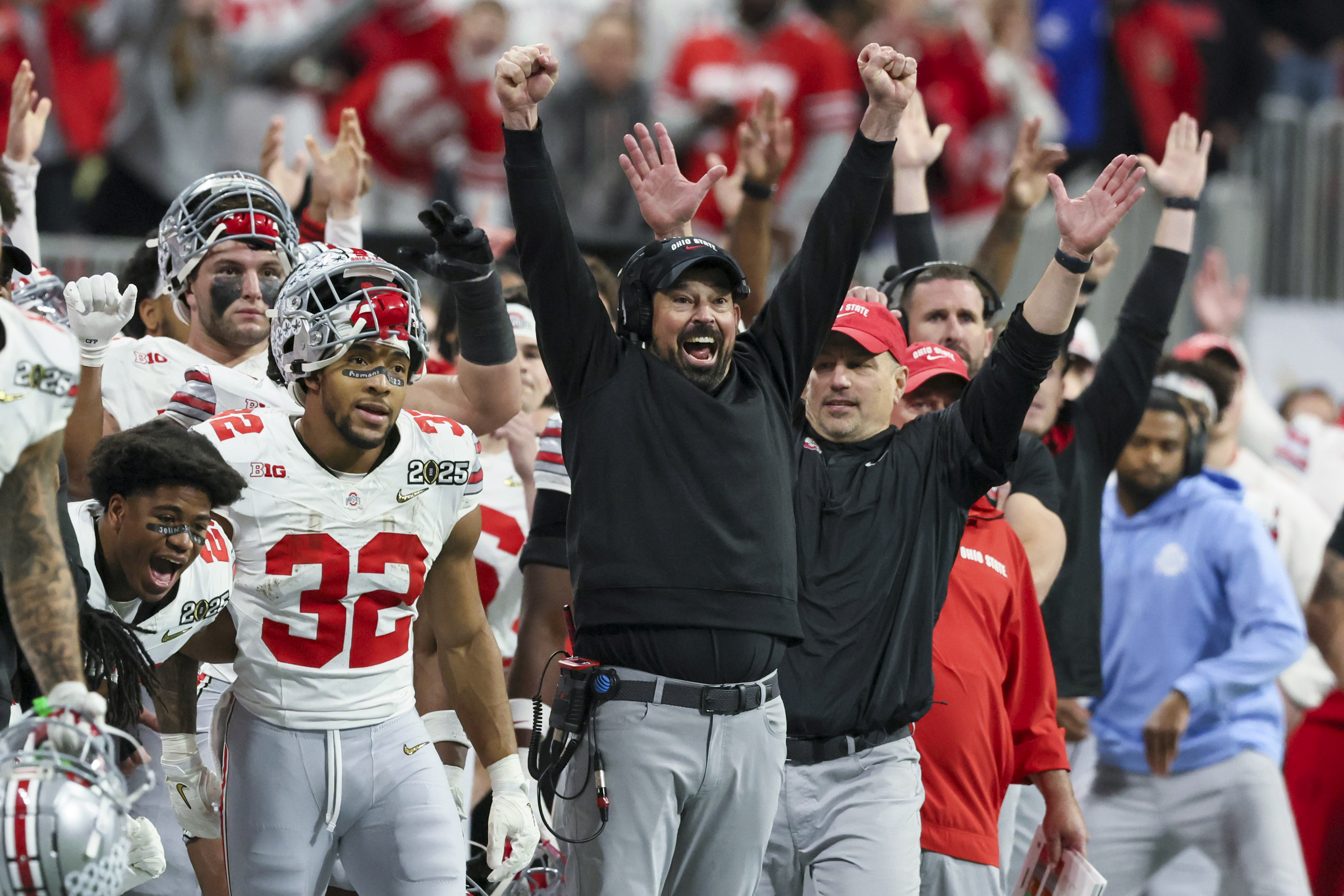 Ohio State head coach Ryan Day and staff celebrate a field goal by place kicker Jayden Fielding during the second half of the College Football Playoff national championship game against Notre Dame, Monday, Jan. 20, 2025, in Atlanta.