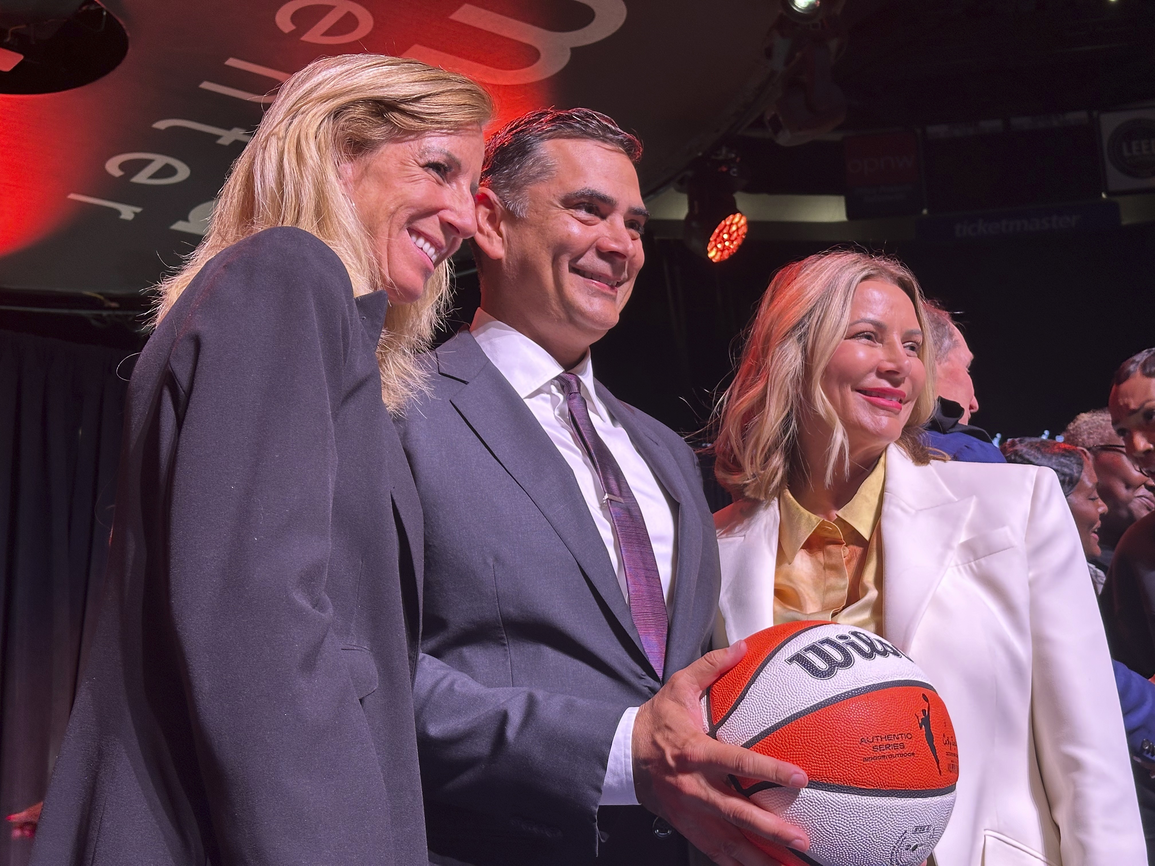 From left, WNBA Commissioner Cathy Engelbert, Alex Bhathal and Lisa Bhathal Merage appear at an event to award Portland a WNBA franchise at the Moda Center on Sept. 18, 2024, at the Moda Center in Portland.