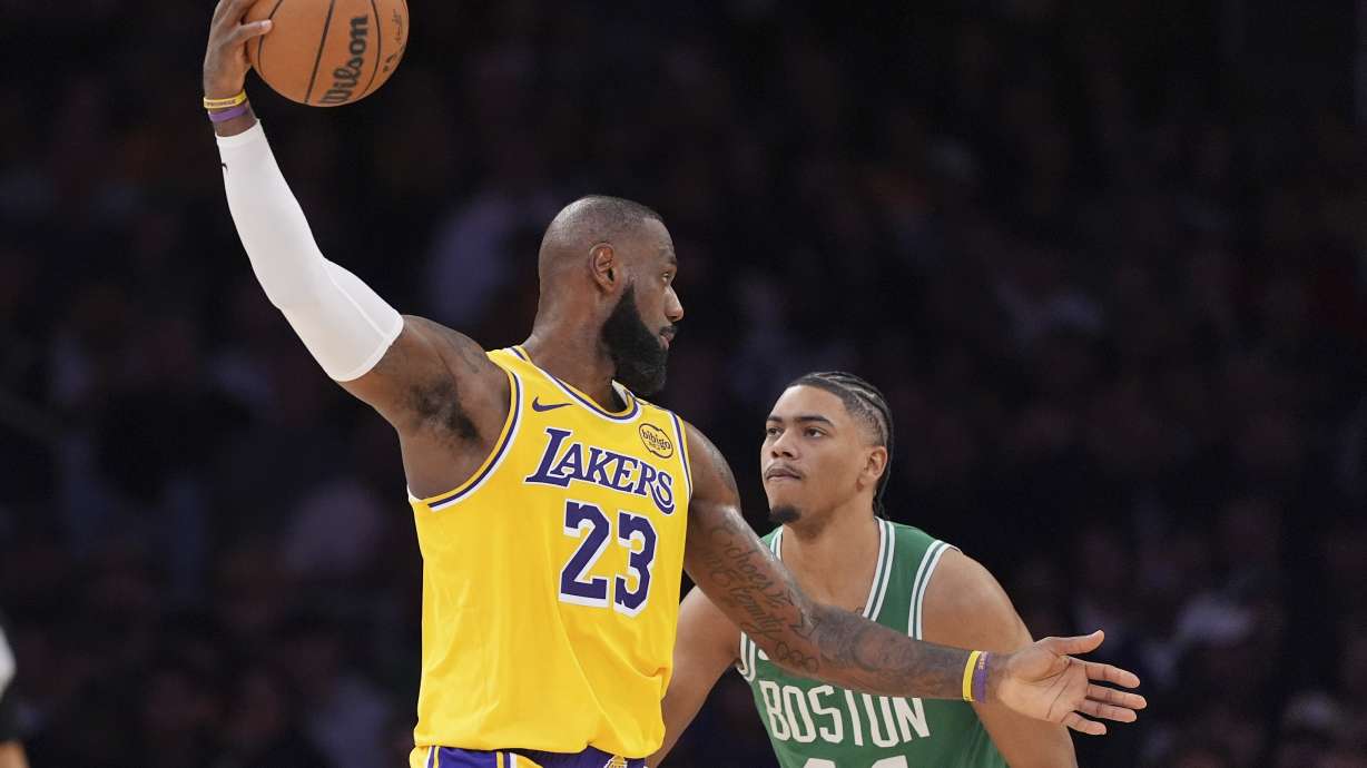 Los Angeles Lakers forward LeBron James, left, tries to pass while under pressure from Boston Celtics guard Jaden Springer during the second half of an NBA basketball game, Thursday, Jan. 23, 2025, in Los Angeles.