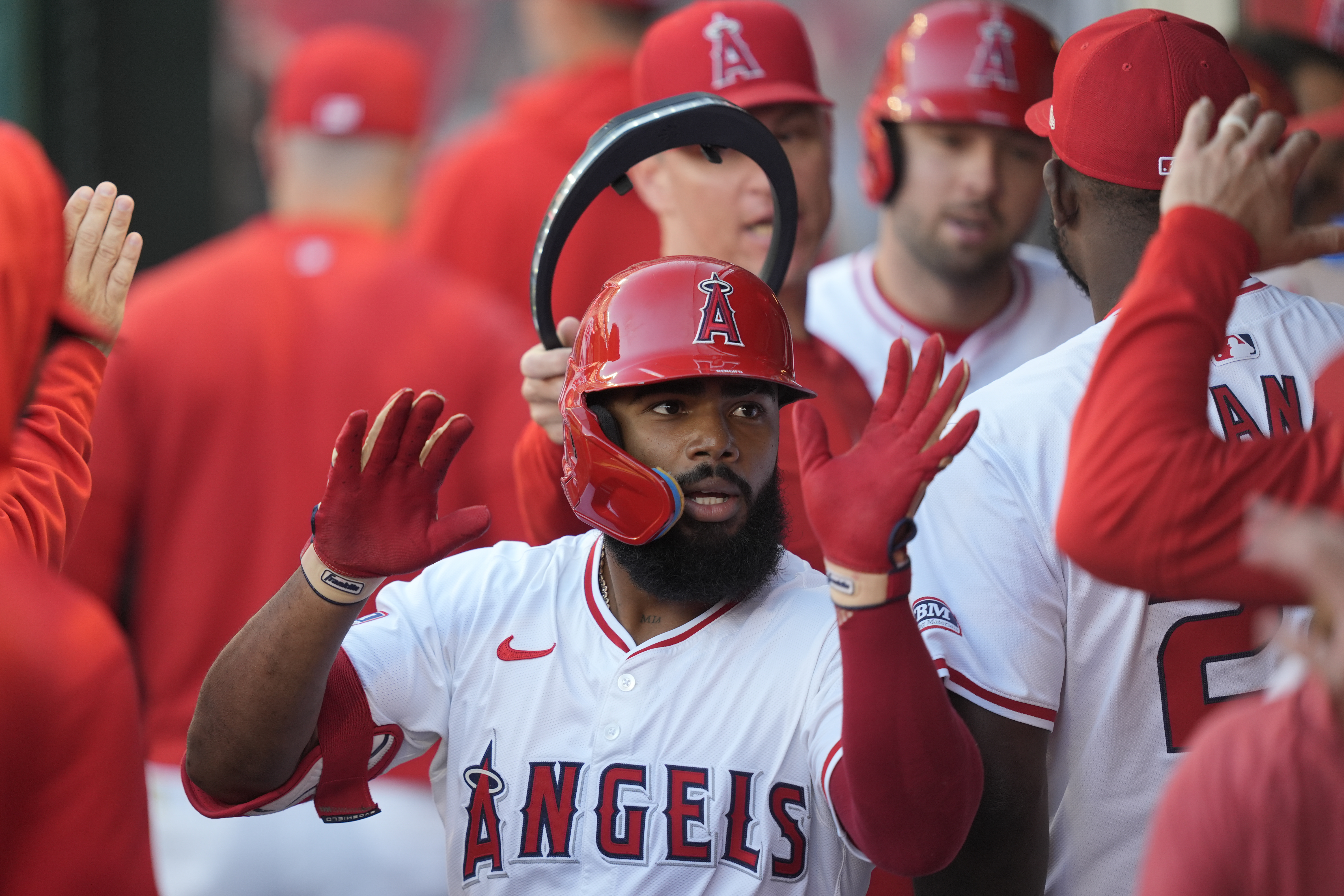 FILE - Los Angeles Angels' Luis Rengifo is congratulated for his two-run home run against the Detroit Tigers during the first inning, June 28, 2024, in Anaheim, Calif.