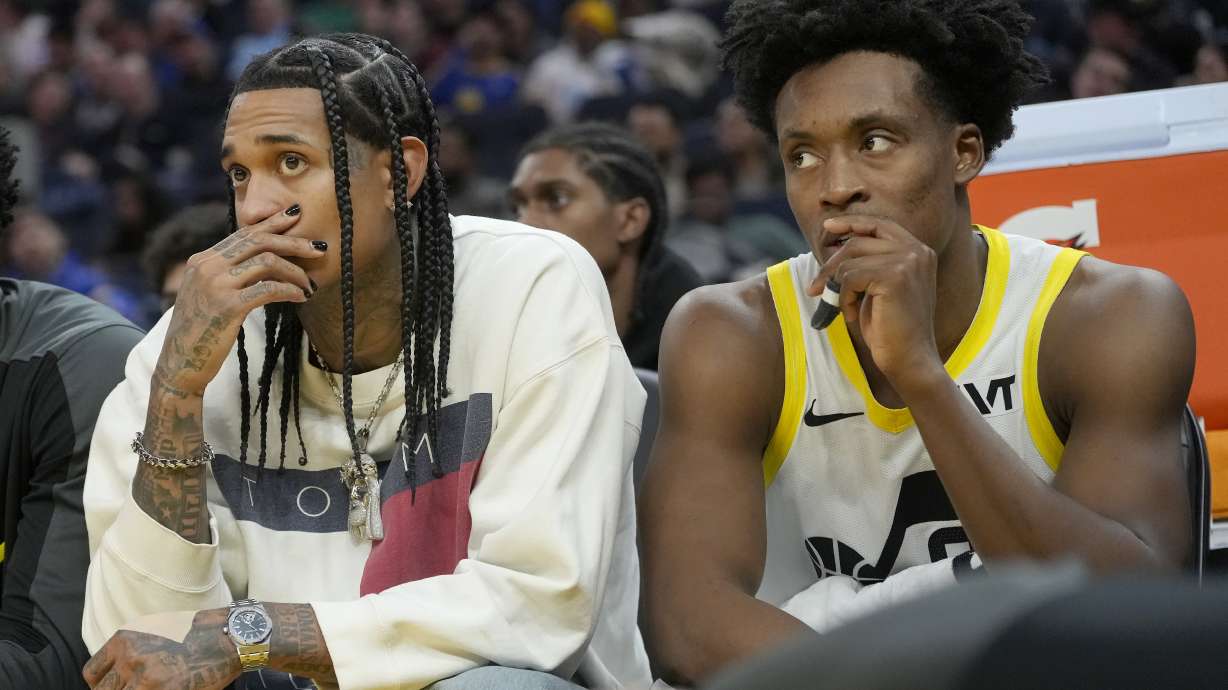 Utah Jazz guard Jordan Clarkson, left, and guard Collin Sexton sit on the bench during the second half of an NBA basketball game against the Golden State Warriors in San Francisco, Tuesday, Jan. 28, 2025.