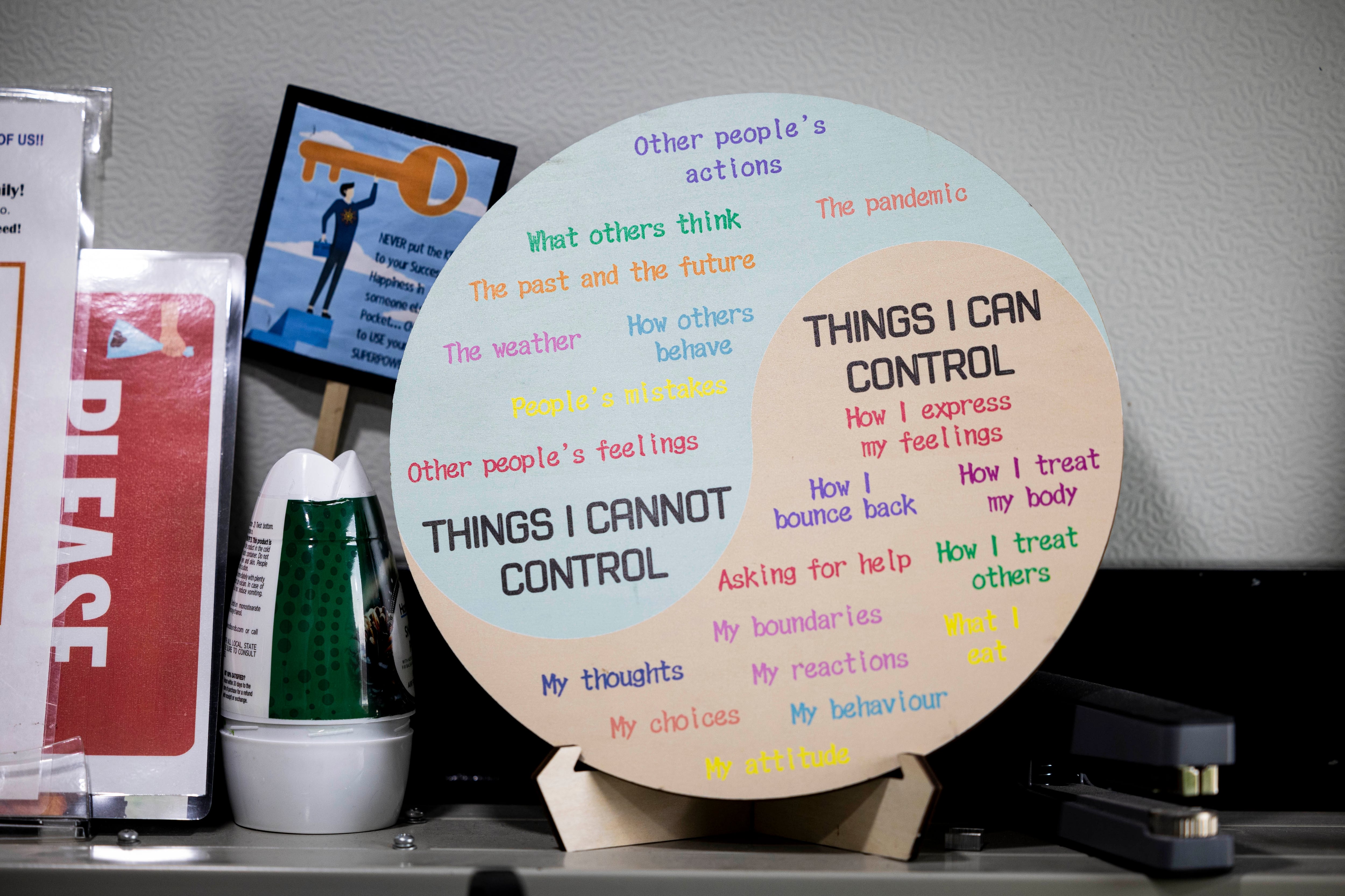 A sign is displayed in an office at a microshelter community operated by Switchpoint in Salt Lake City on Thursday.