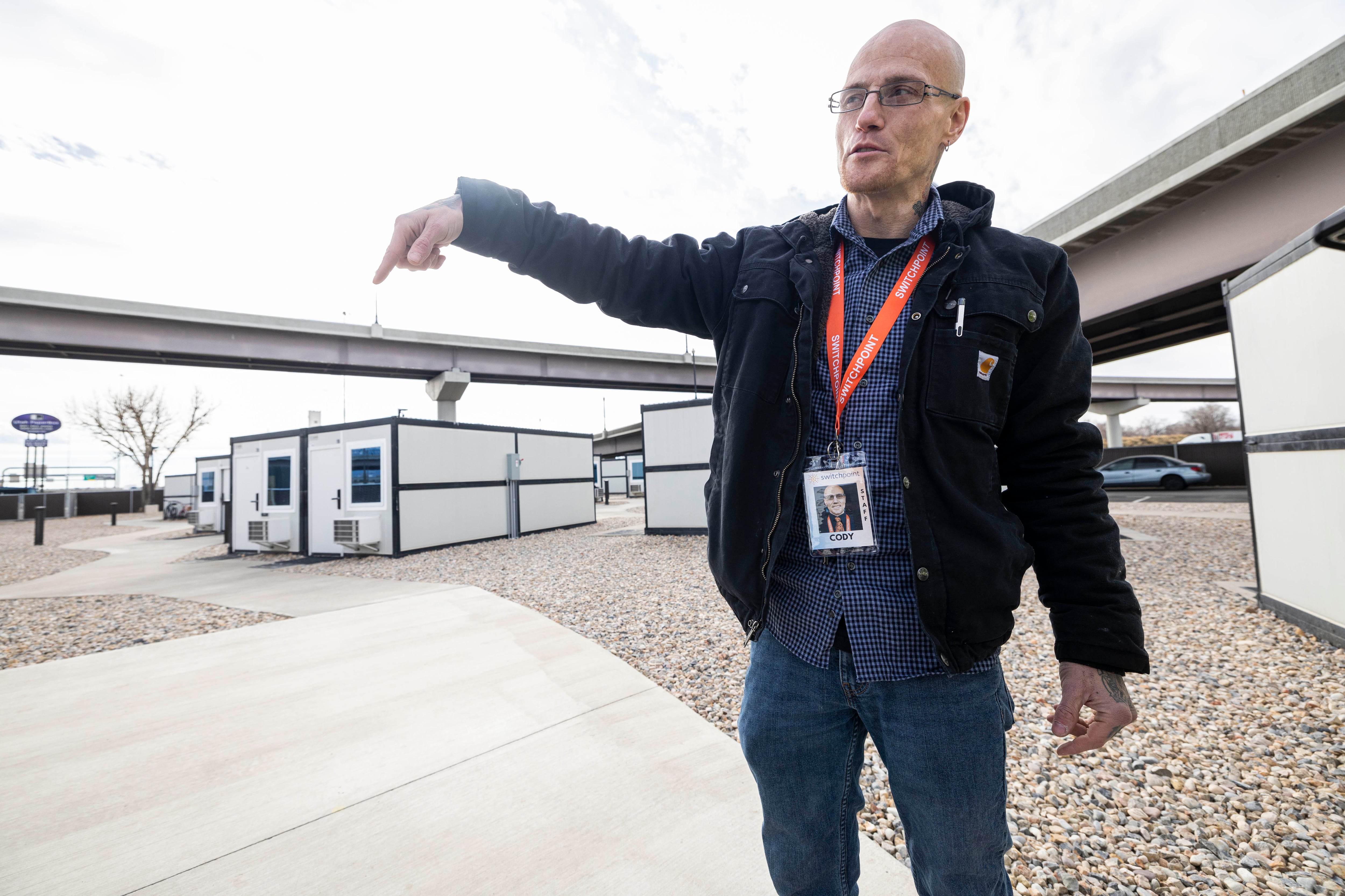 Cody Egbert, microshelter site director, gives a tour to a Deseret News reporter at a microshelter community operated by Switchpoint in Salt Lake City on Thursday.