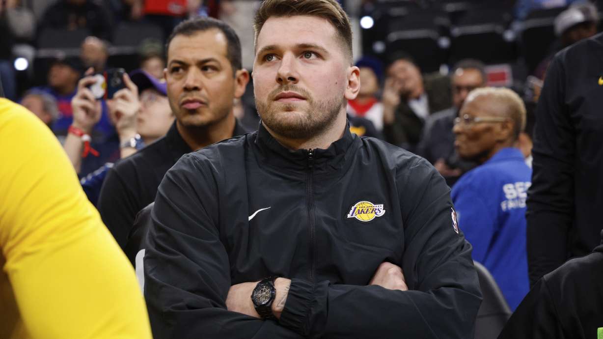 Los Angeles Lakers guard Luka Doncic sits on the bench before an NBA basketball game against the Los Angeles Clippers, Tuesday, Feb. 4, 2025, in Inglewood, Calif.