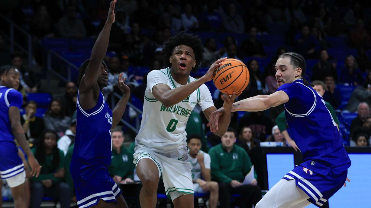 Dominick Nelson driving to the rim with contact.