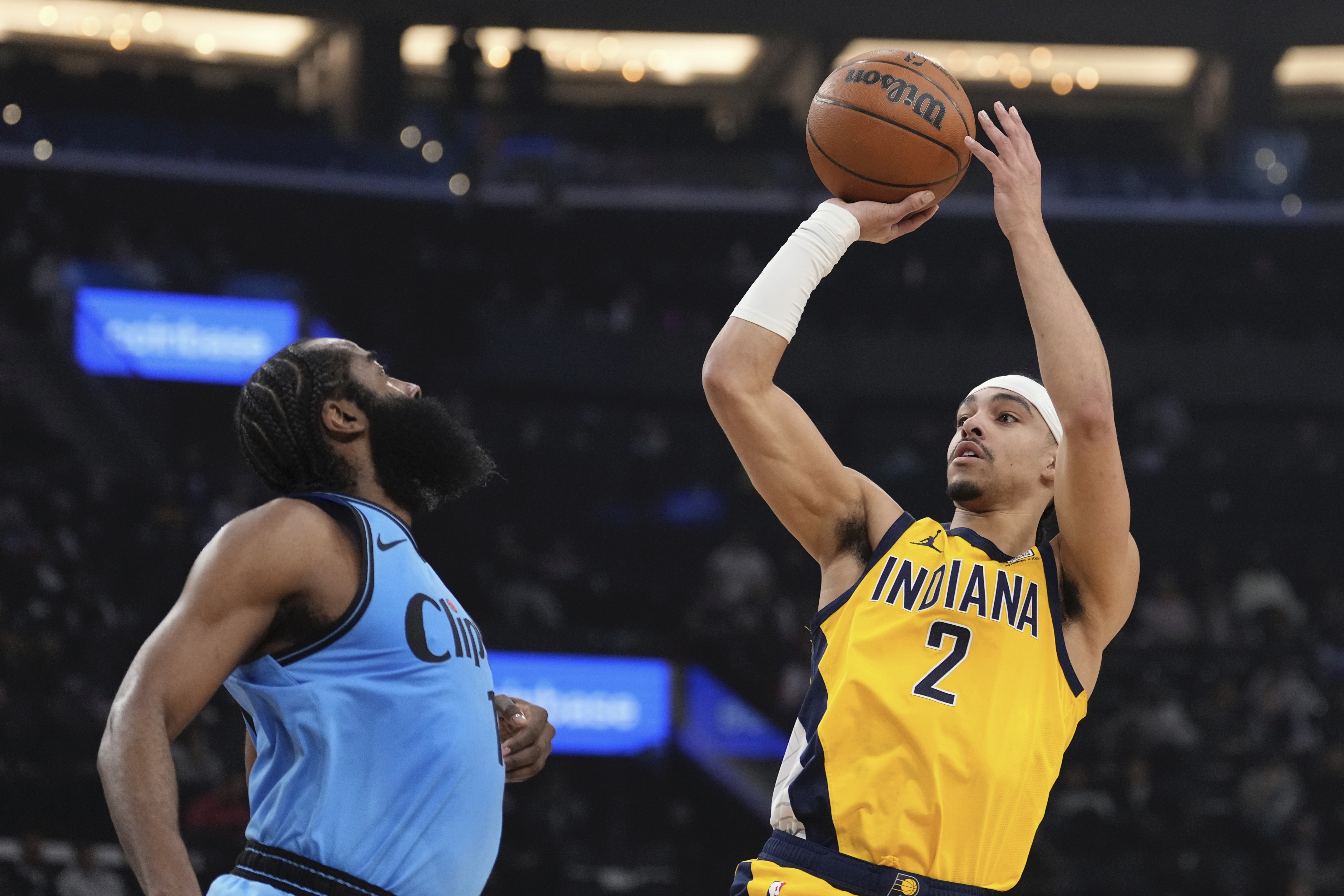 Indiana Pacers guard Andrew Nembhard, right, shoots as Los Angeles Clippers guard James Harden defends during the first half of an NBA basketball game, Thursday, Feb. 6, 2025, in Inglewood, Calif.