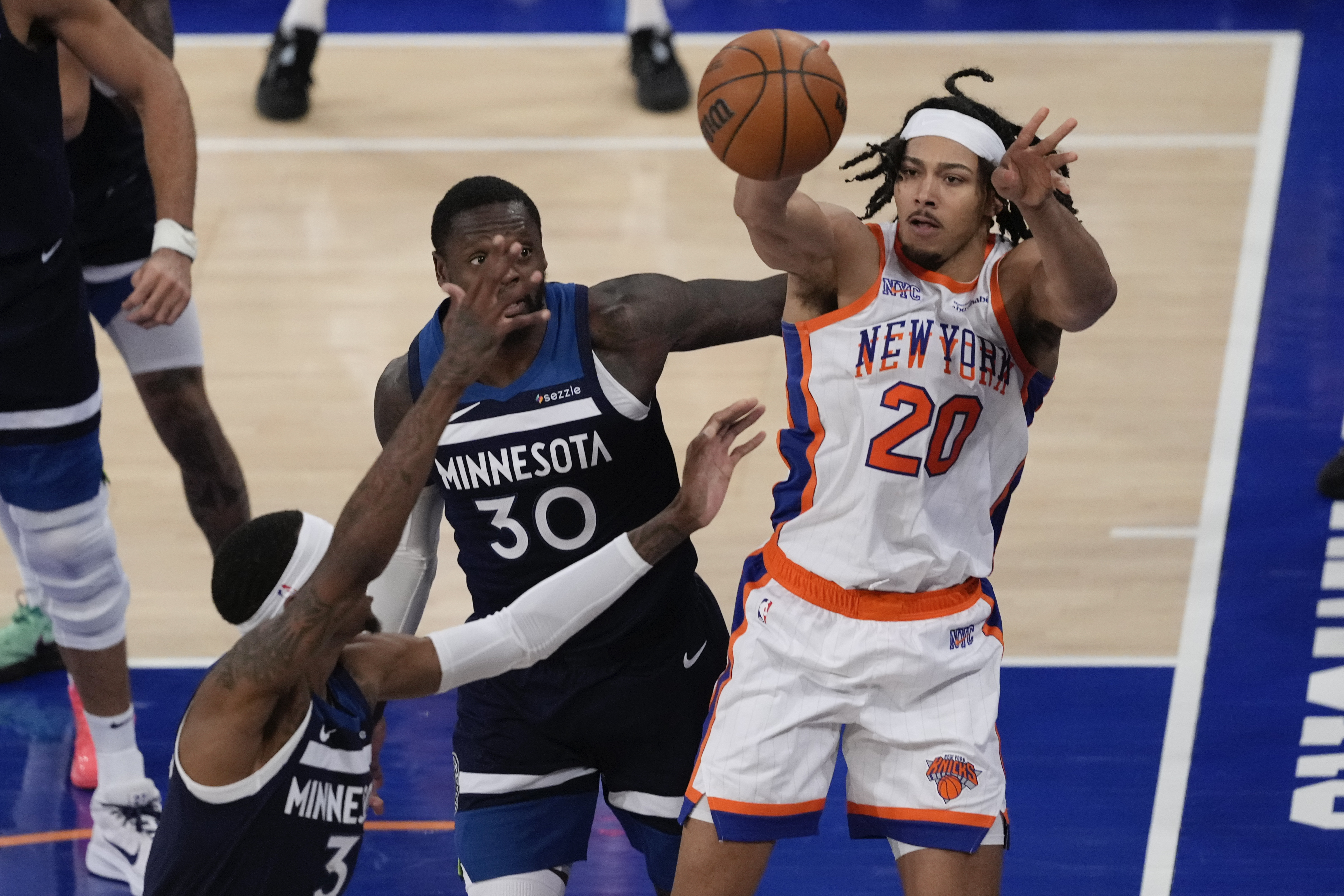 New York Knicks' Jericho Sims (20) passes away from Minnesota Timberwolves' Julius Randle (30) during the second half of an NBA basketball game, Friday, Jan. 17, 2025, in New York.