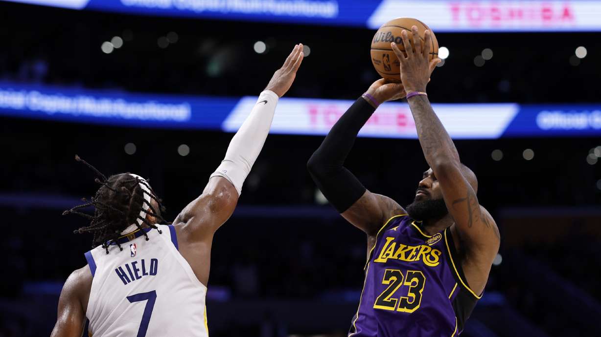 Los Angeles Lakers forward LeBron James shoots a jumper against Golden State Warriors guard Buddy Hield during the second half of an NBA basketball game Thursday, Feb. 6, 2025, in Los Angeles.