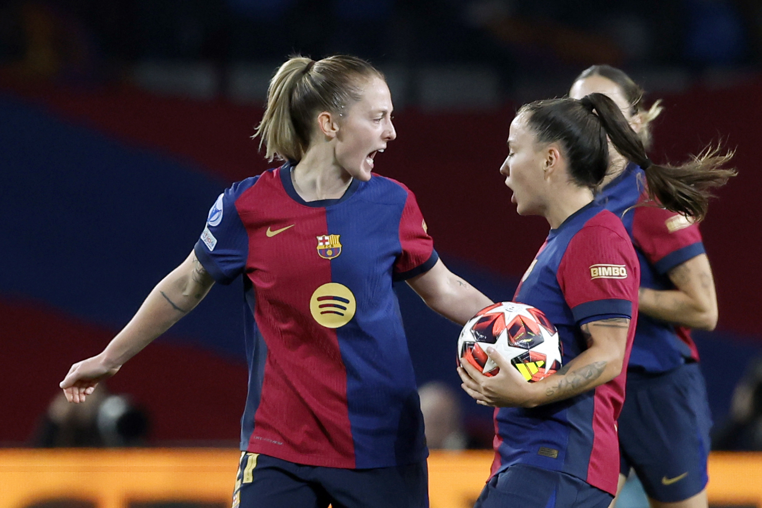 FILE - Barcelona's Keira Walsh, left, congratulates Claudia Pina after scoring during the women's Champions League group D soccer match between FC Barcelona and Manchester City at the Olympic Stadium in Barcelona, Spain, Dec. 18, 2024.