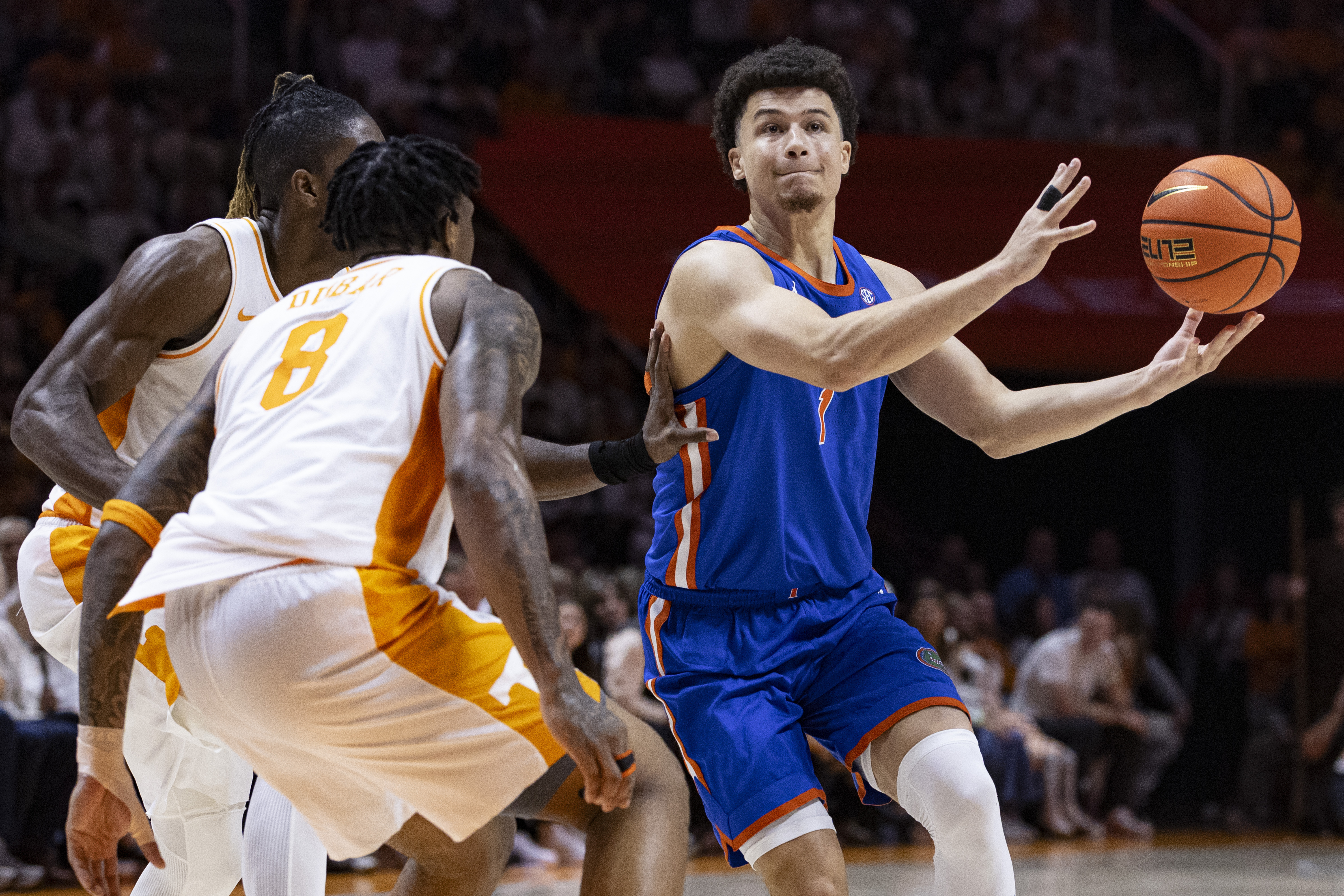 Florida guard Walter Clayton Jr. (1) loses control of the ball as he drives against Tennessee guard Darlinstone Dubar (8) and Jahmai Mashack during the second half of an NCAA college basketball game Saturday, Feb. 1, 2025, in Knoxville, Tenn.