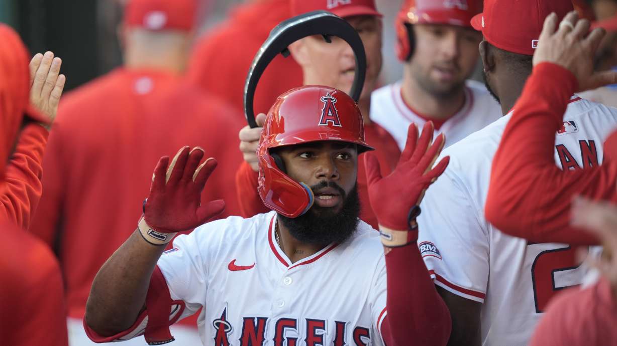 FILE - Los Angeles Angels' Luis Rengifo is congratulated for his two-run home run against the Detroit Tigers during the first inning, June 28, 2024, in Anaheim, Calif.
