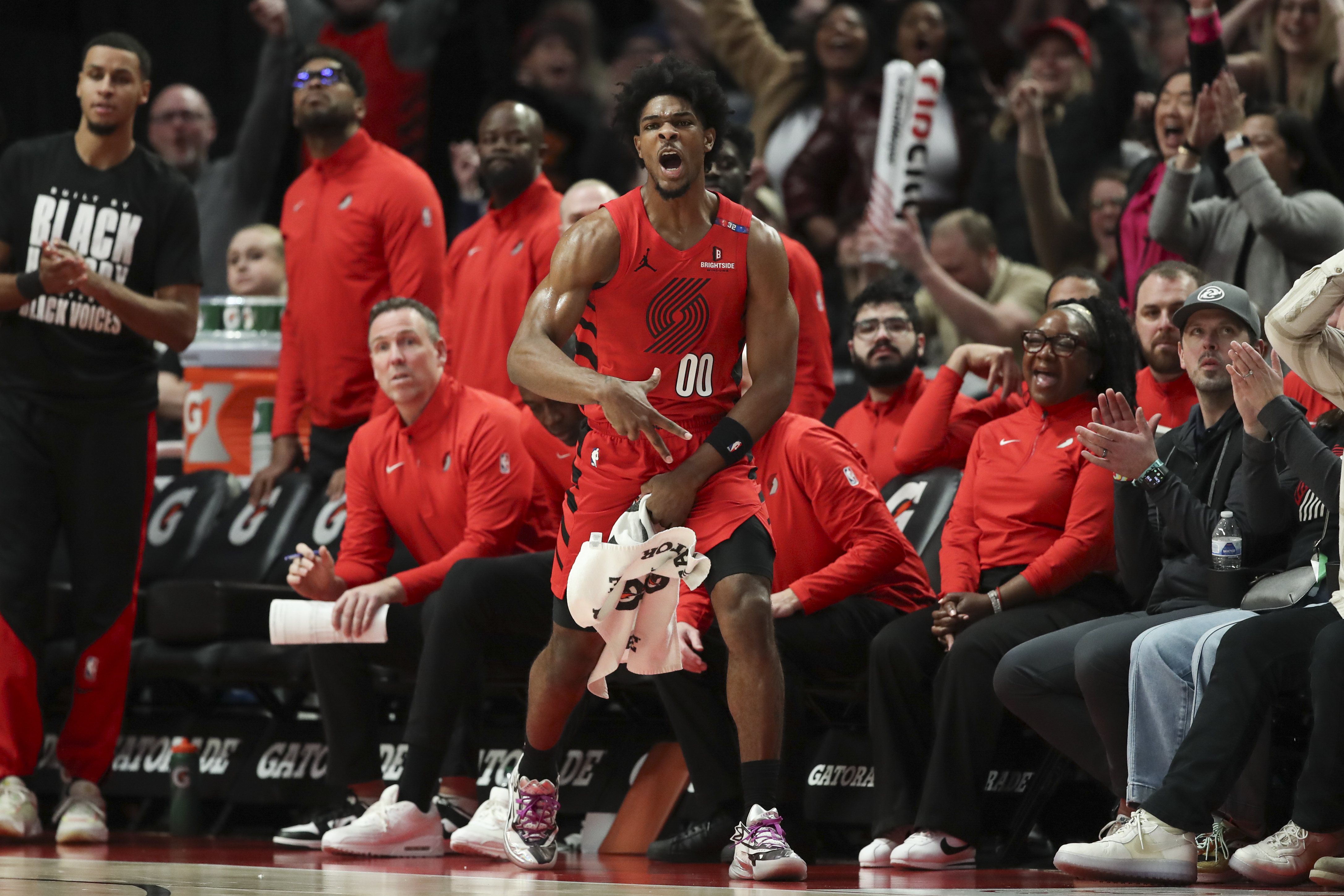 Portland Trail Blazers guard Scoot Henderson (00) reacts to a Blazers basket against the Phoenix Suns during the second half of an NBA basketball game Monday, Feb. 3, 2025, in Portland, Ore.
