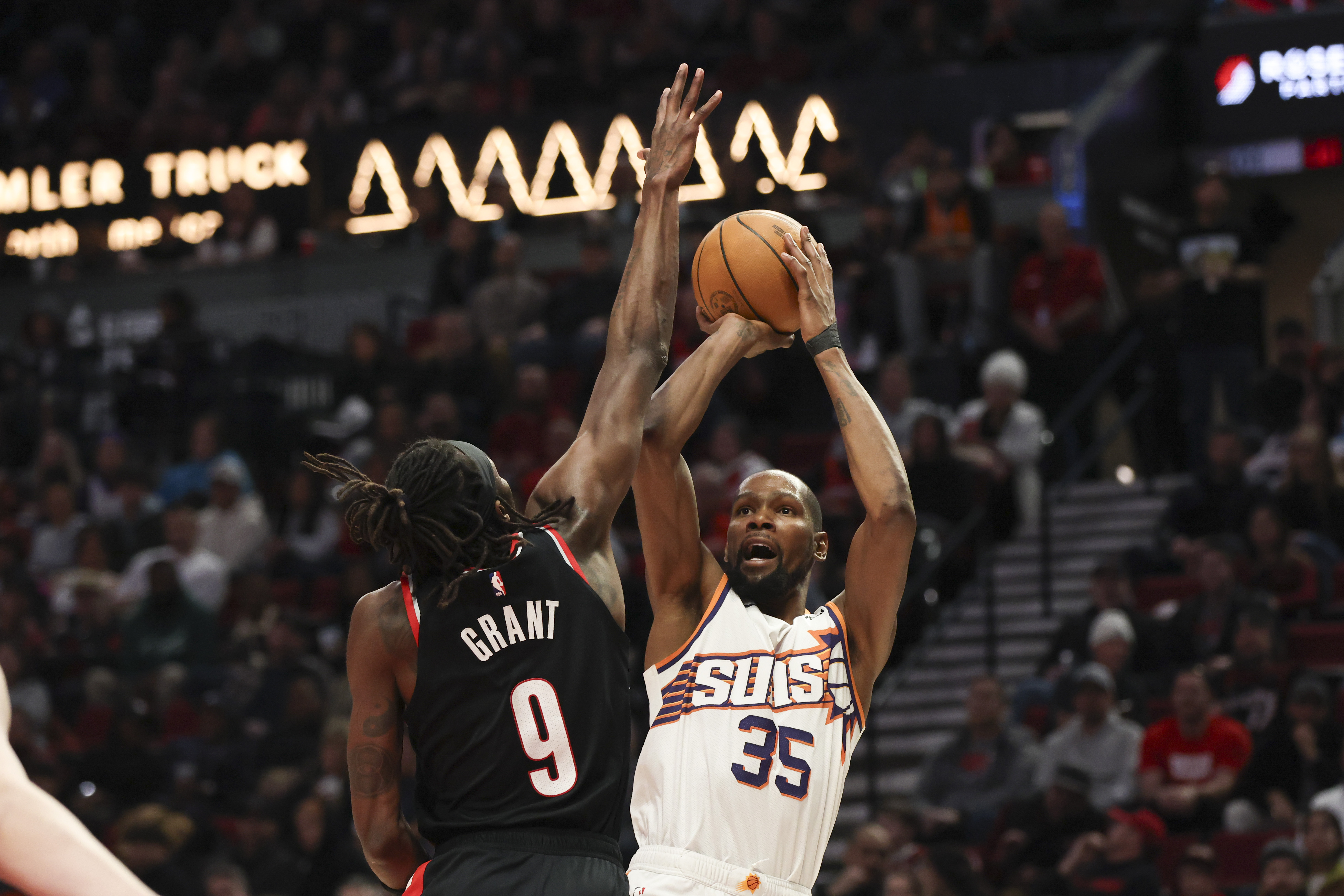Phoenix Suns forward Kevin Durant (35) shoots over Portland Trail Blazers forward Jerami Grant (9) during the second half of an NBA basketball game Saturday, Feb. 1, 2025, in Portland, Ore.