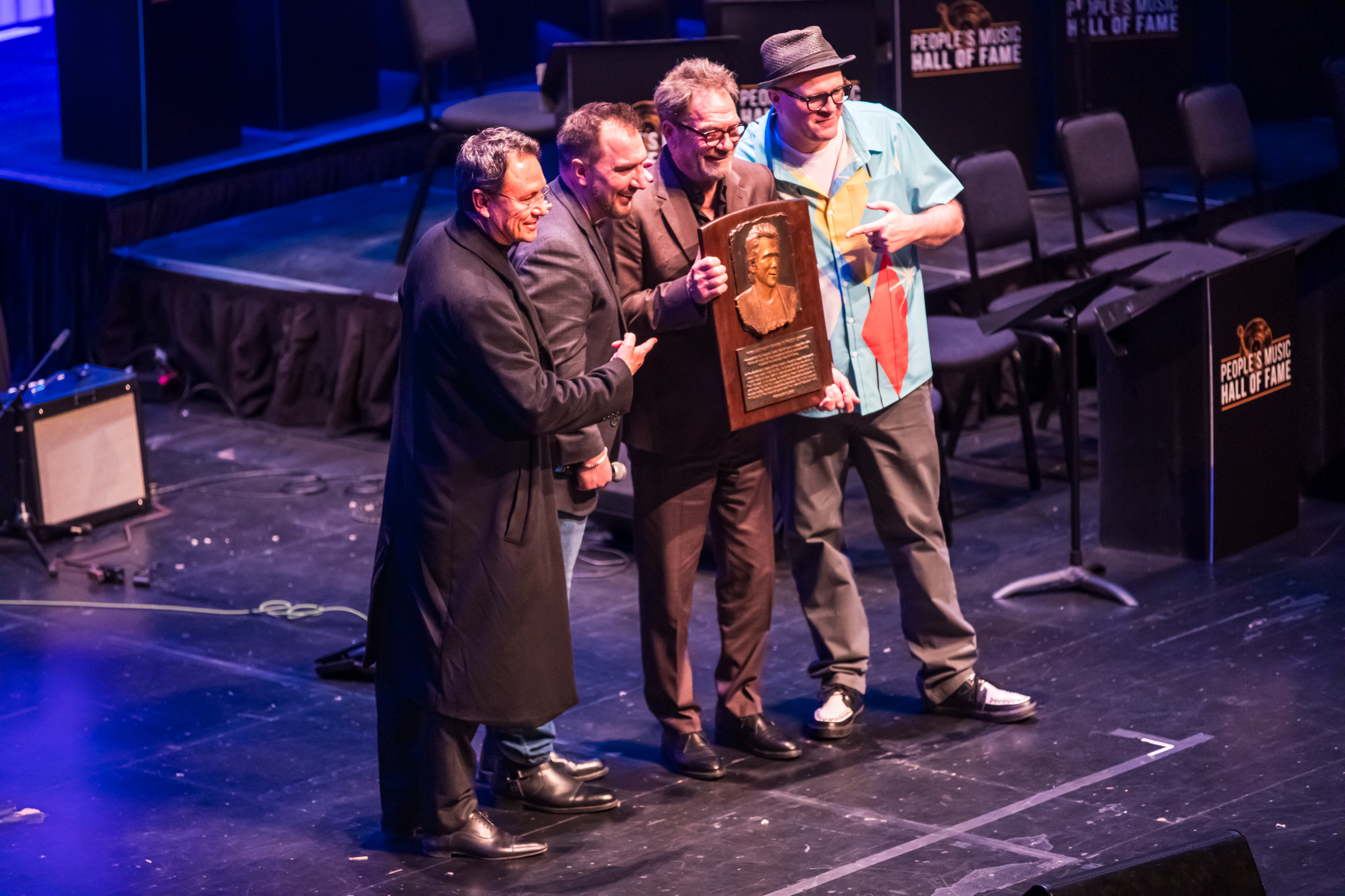 Entrepreneur Brandon Fugal; Caleb Chapman, Soundhouse founder and CEO; Huey Lewis and Adam Reader, Professor of Rock, pose as Lewis is enshrined into the People’s Music Hall of Fame at the Eccles Theater in Salt Lake City Friday.