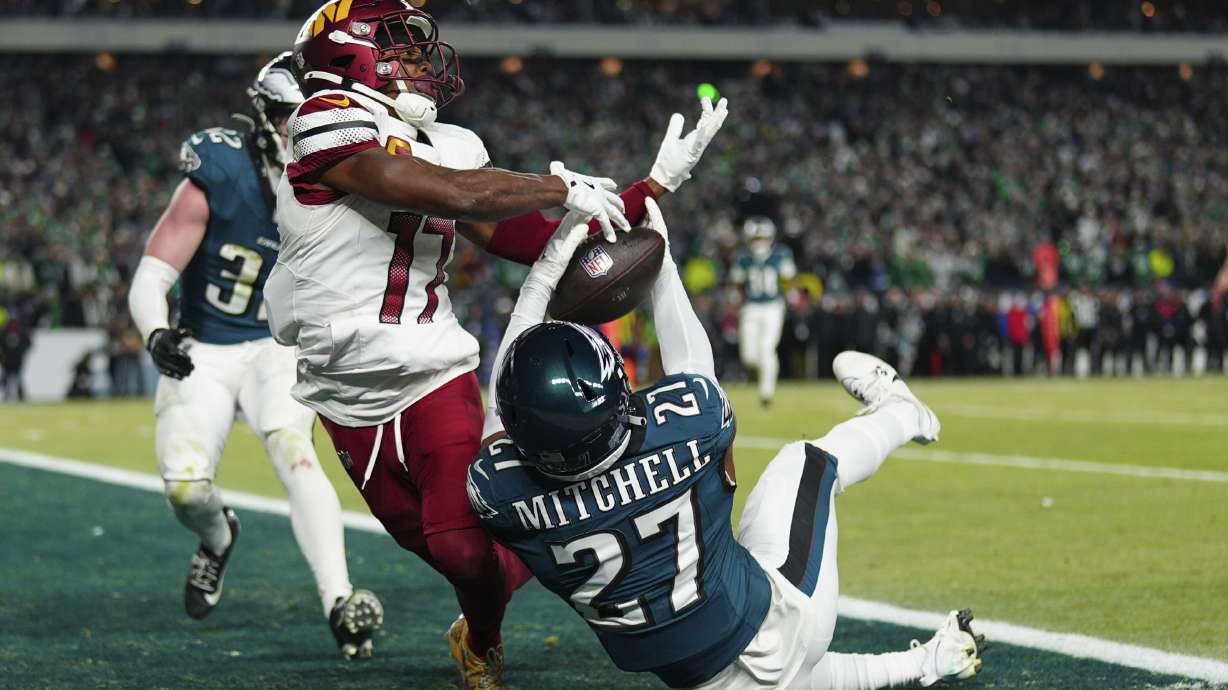Philadelphia Eagles cornerback Quinyon Mitchell (27) intercepts a pass intended for Washington Commanders wide receiver Terry McLaurin (17) during the second half of the NFC Championship NFL football game, Sunday, Jan. 26, 2025, in Philadelphia.