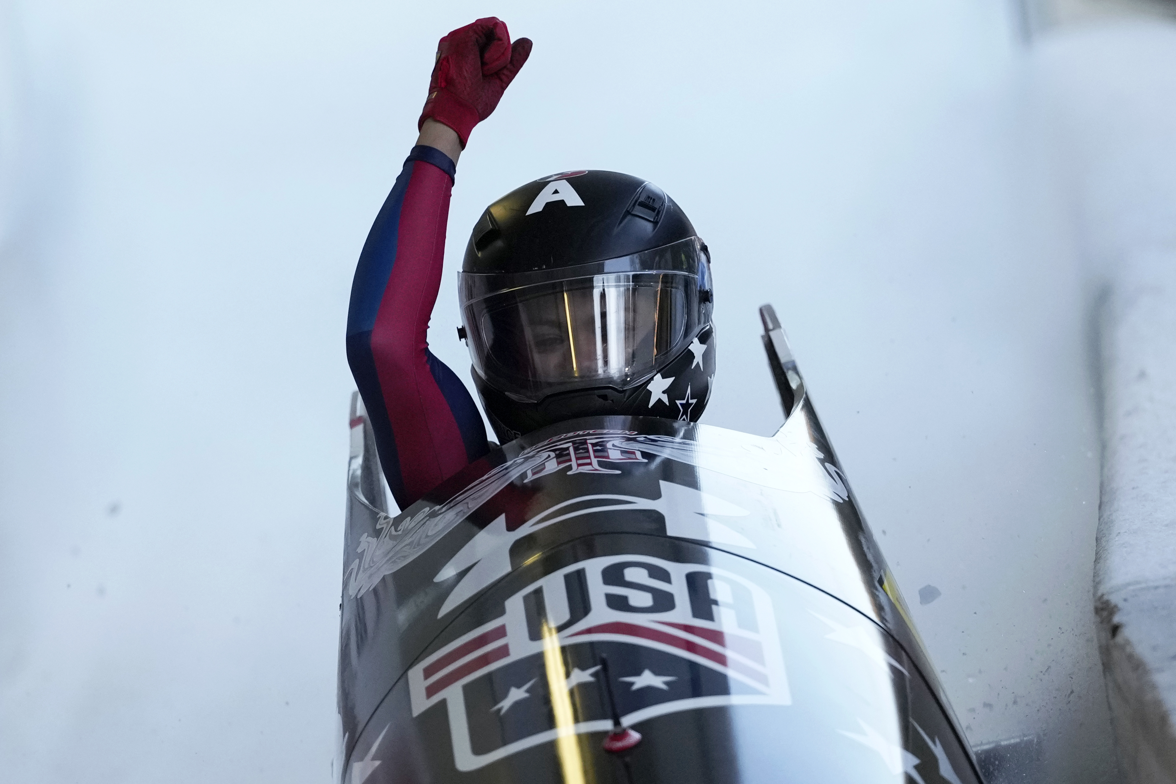 Kaysha Love, of the United States, celebrates as she finishes her second run in the women's monobob at the Bobsleigh World Cup in Innsbruck, Austria, Saturday, Jan. 18, 2025.