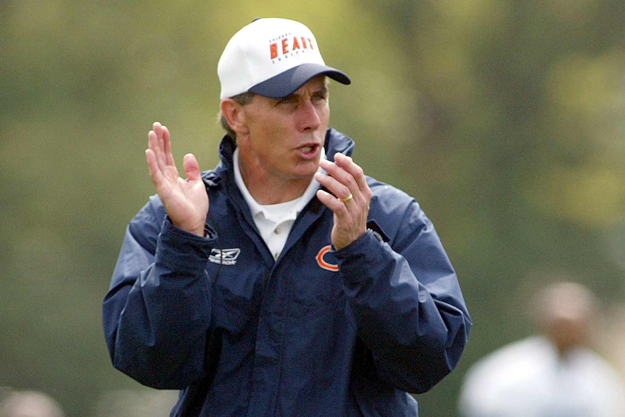 FILE - Chicago Bears coach Dick Jauron calls out to his team while observing offensive drills in morning training camp practice Saturday, July 27, 2002 at Olivet Nazarene University in Bourbonnais, Ill.