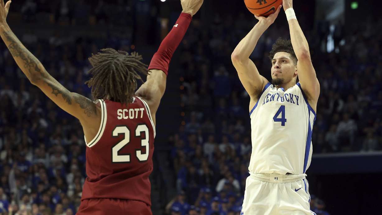 Kentucky's Koby Brea (4) shoots over South Carolina's Cam Scott (23) during the first half of an NCAA college basketball game in Lexington, Ky., Saturday, Feb. 8, 2025.