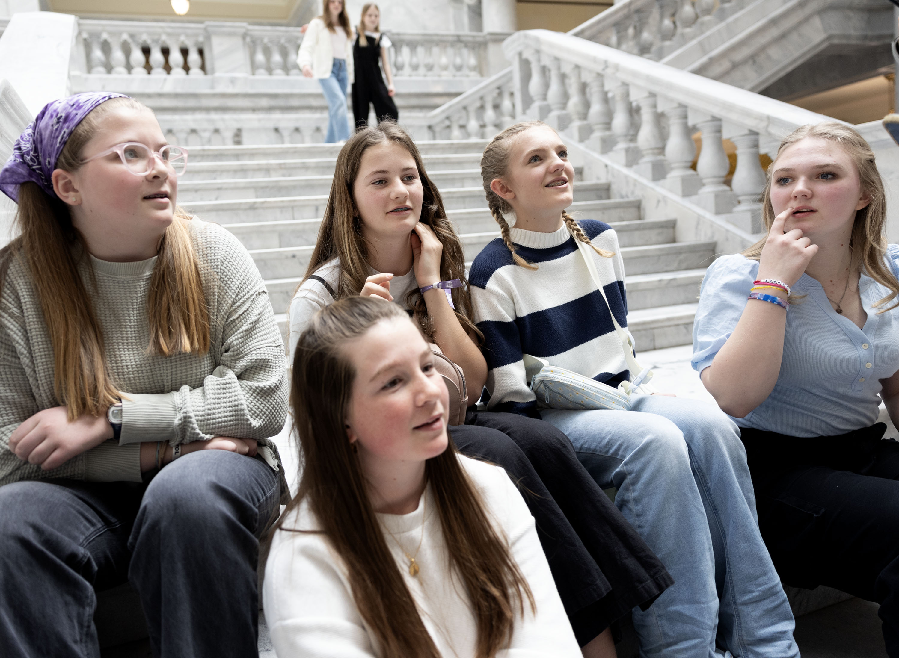 Lily Lofgran, left, Lyla Holbrook, Myka Shuflin, Elizabeth Prows and Grace Jeppson debate how to spell “Utahn” at the Capitol in Salt Lake City on Thursday.