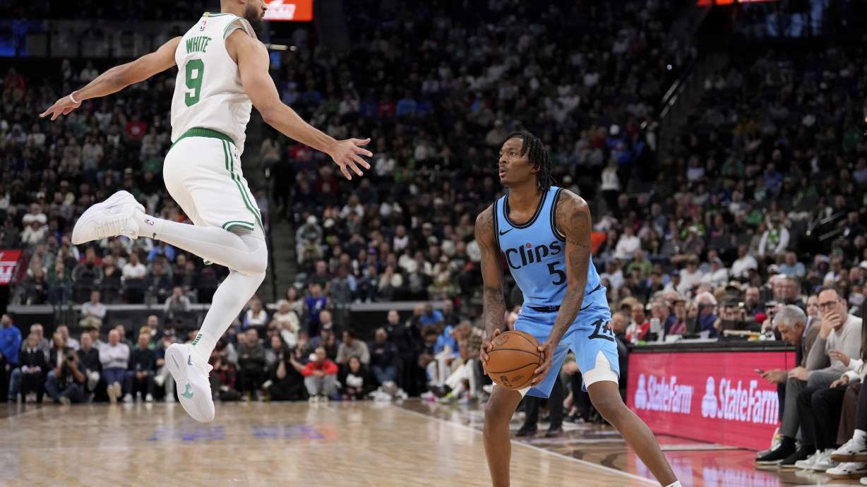 Los Angeles Clippers guard Bones Hyland, right, tries to shoot as Boston Celtics guard Derrick White defends during the second half of an NBA basketball game, Wednesday, Jan. 22, 2025, in Inglewood, Calif.