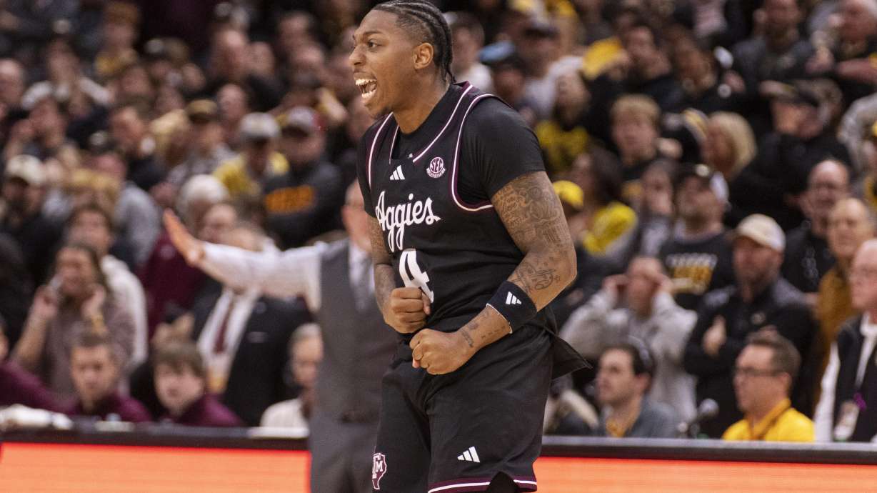 Texas A&M's Wade Taylor IV celebrates after his winning basket in the final seconds of an NCAA college basketball game against Missouri, Saturday, Feb. 8, 2025, in Columbia, Mo. Texas A&M won 67-64.