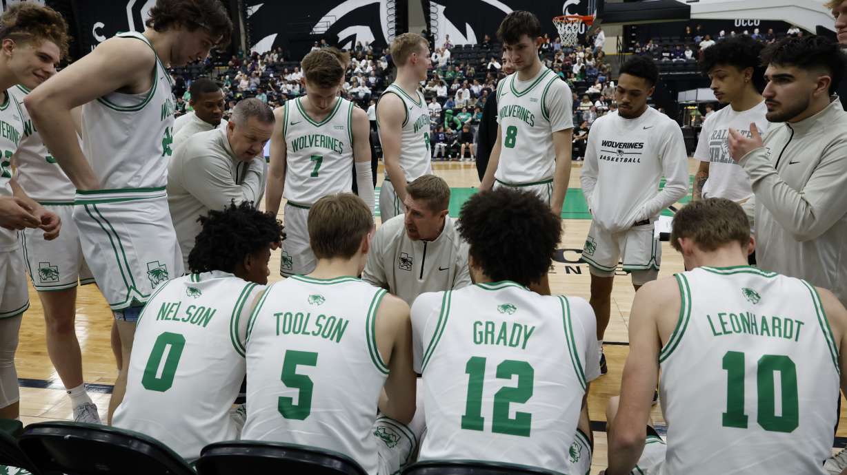 Head coach Todd Phillips talking to his team during a timeout.