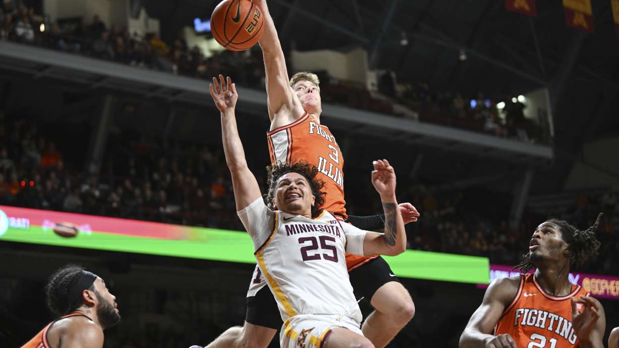 Illinois forward Ben Humrichous (3) blocks a shot by Minnesota guard Lu'Cye Patterson (26) as Illinois forward Morez Johnson Jr. (21) looks on during the first half of an NCAA college basketball game on Saturday, Feb. 8, 2025, in Minneapolis.