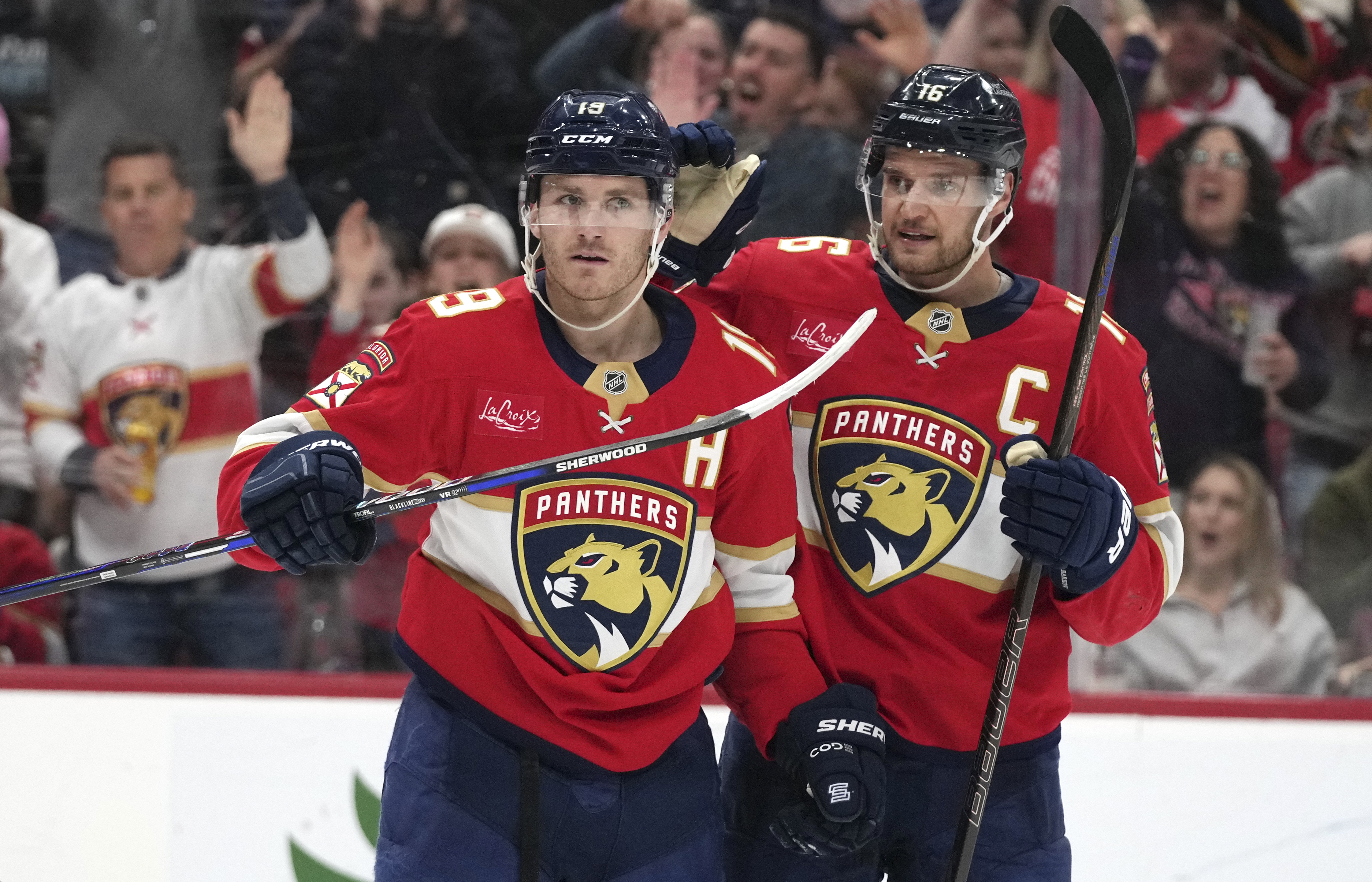 Florida Panthers left wing Matthew Tkachuk (19) celebrates with center Aleksander Barkov (16) after scoring a goal during the second period of an NHL hockey game against the Ottawa Senators Saturday, Feb. 8, 2025, in Sunrise, Fla.