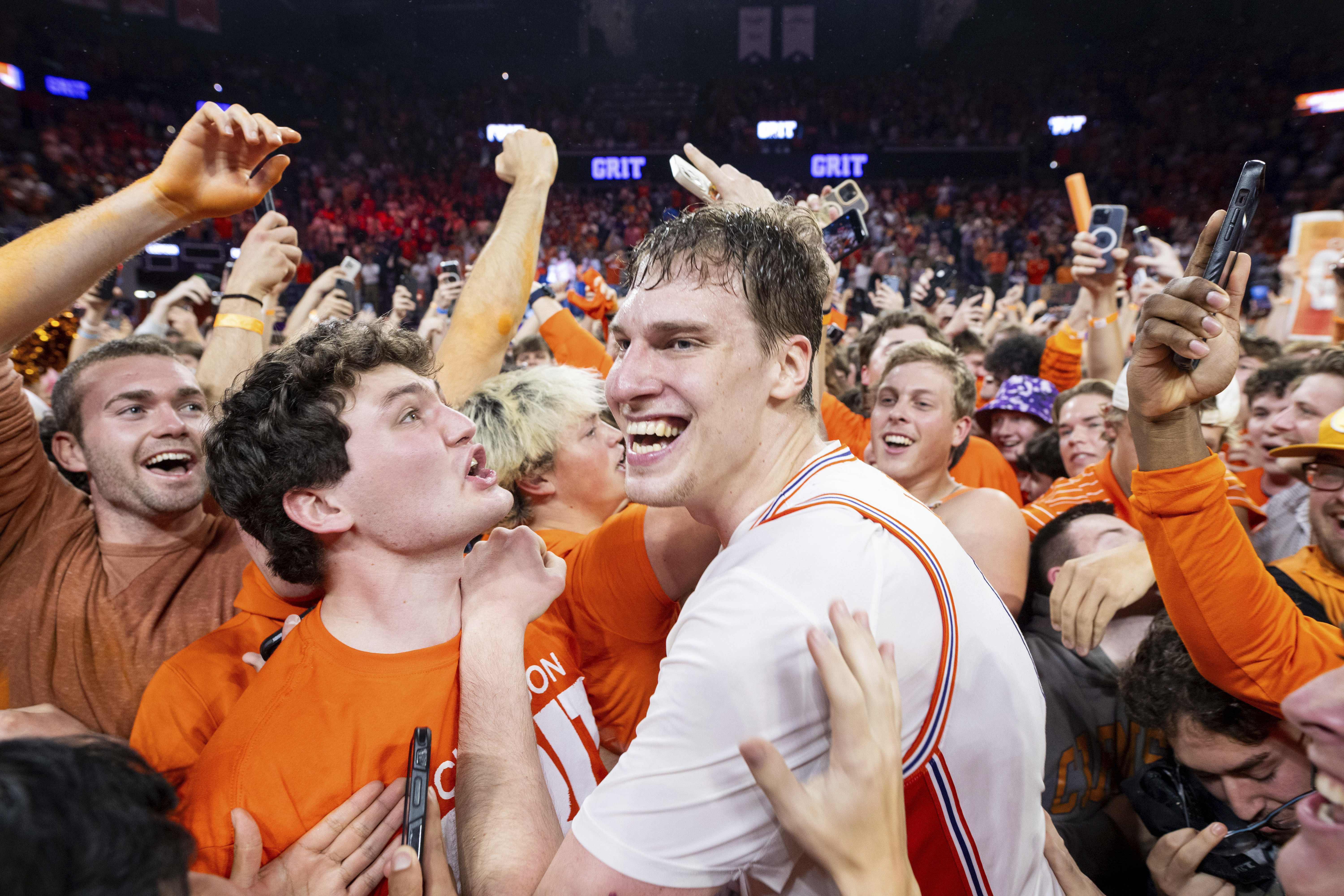 Clemson center Viktor Lakhin celebrates with students after defeating Duke in an NCAA college basketball game on Saturday, Feb. 8, 2025, in Clemson, S.C.