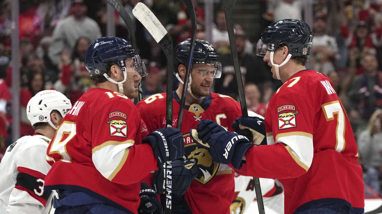 Florida Panthers center Aleksander Barkov (16) is congratulated after scoring a goal during the second period of an NHL hockey game against the Ottawa Senators Saturday, Feb. 8, 2025, in Sunrise, Fla.
