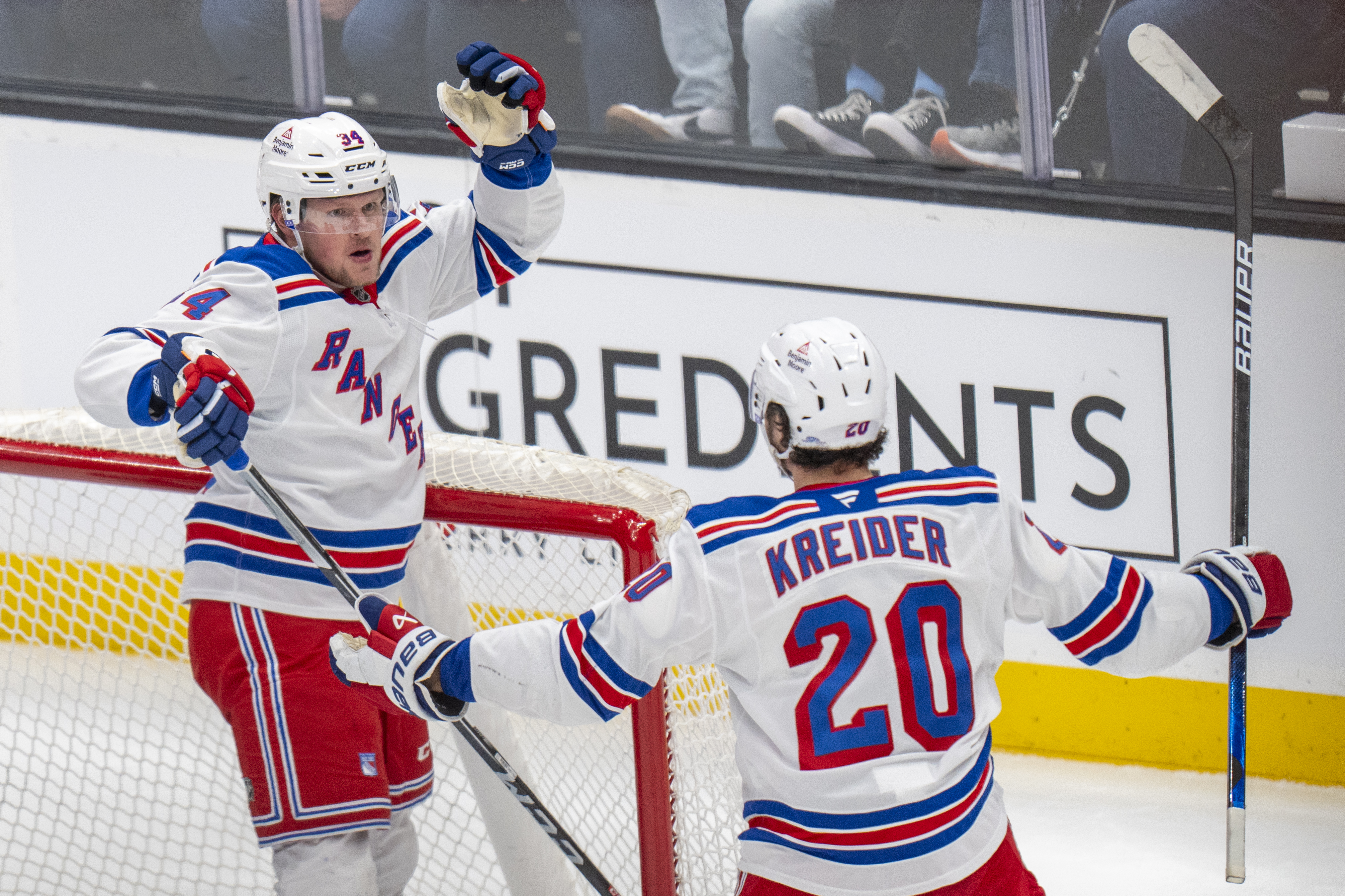 New York Rangers right wing Arthur Kaliyev and New York Rangers left wing Chris Kreider (20) celebrate Kaliyey's goal, during the first period of an NHL hockey game, Thursday, Jan. 16, 2025, in Salt Lake City.