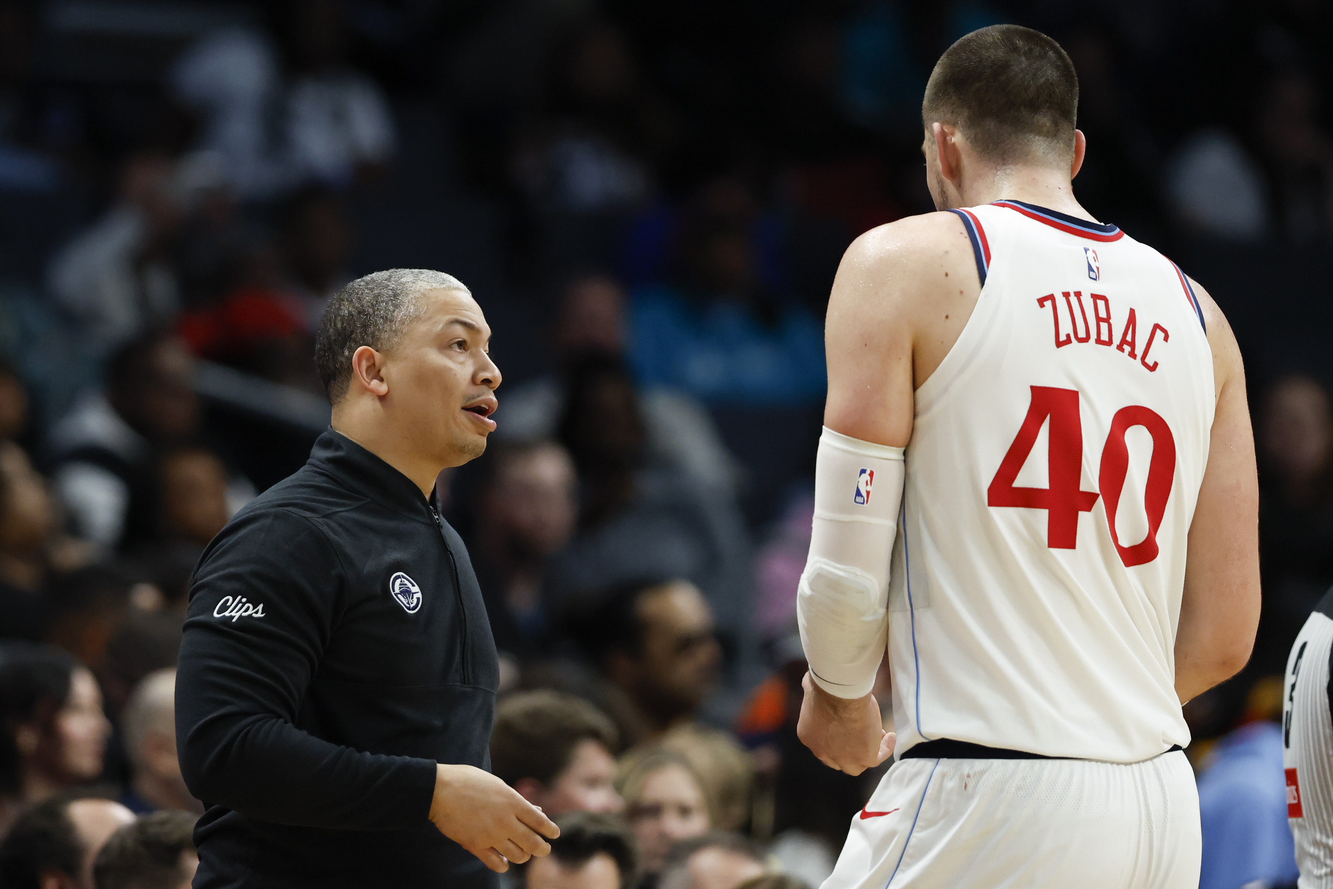 Los Angeles Clippers head coach Tyronn Lue, left, talks to center Ivica Zubac (40) during the second half of an NBA basketball game against the Charlotte Hornets in Charlotte, N.C., Friday, Jan. 31, 2025.