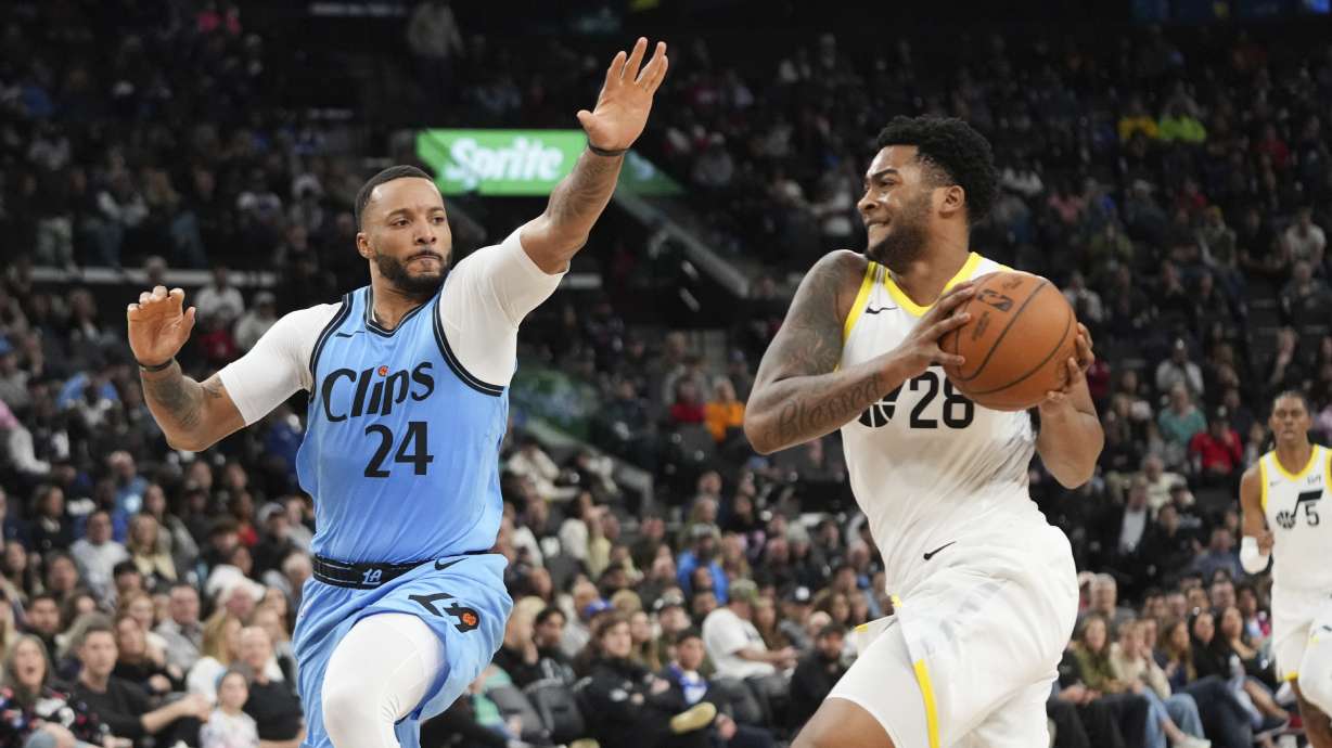 Los Angeles Clippers' Norman Powell (24) pressures Utah Jazz's Brice Sensabaugh (28) during the second half of an NBA basketball game Saturday, Feb. 8, 2025, in Inglewood, Calif.