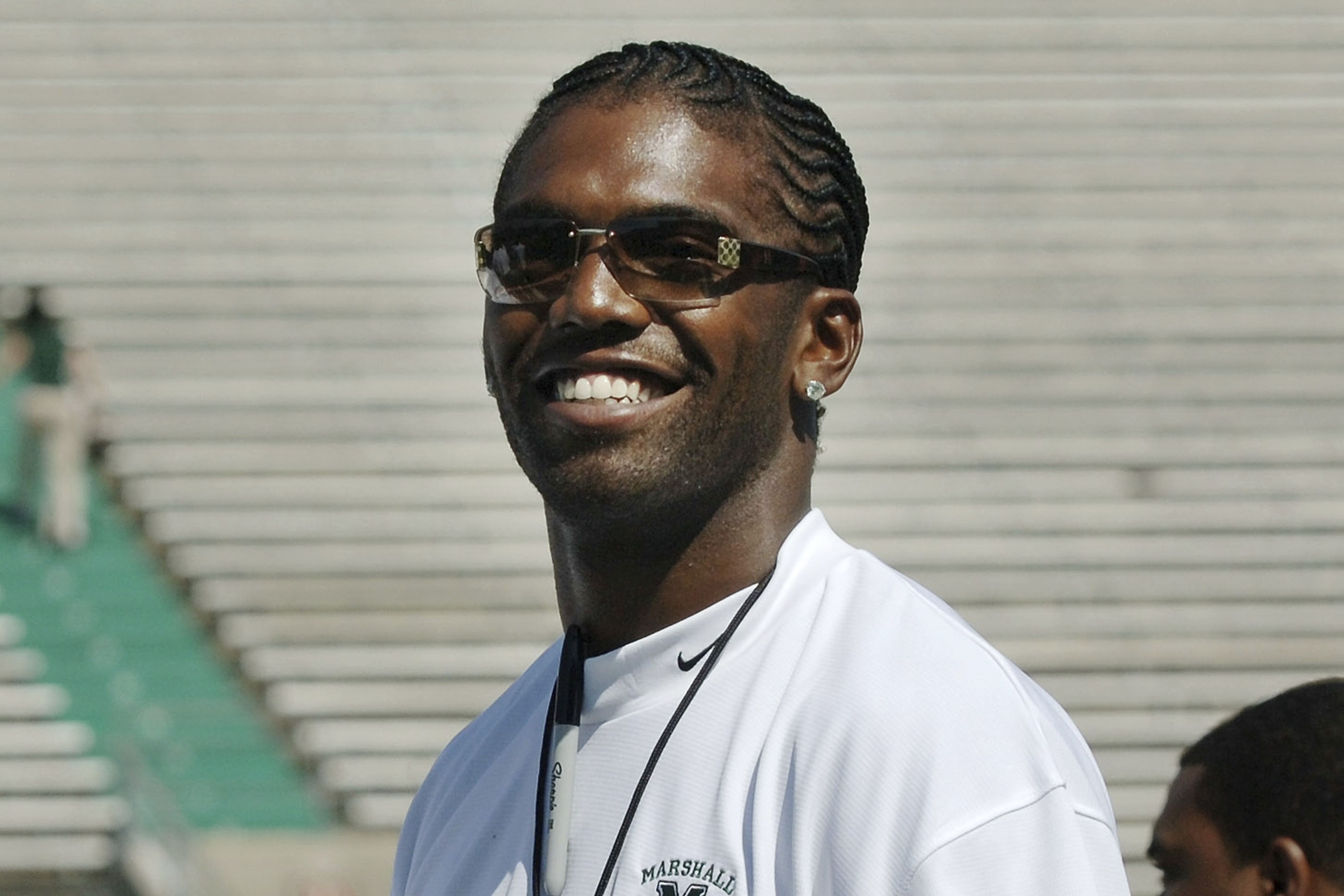 FILE - Former Marshall football player Randy Moss of the Oakland Raiders waves to fans prior to serving as an honorary coach during Marshall's annual Green-White game Saturday, April 22, 2006, in Huntington, W.Va.