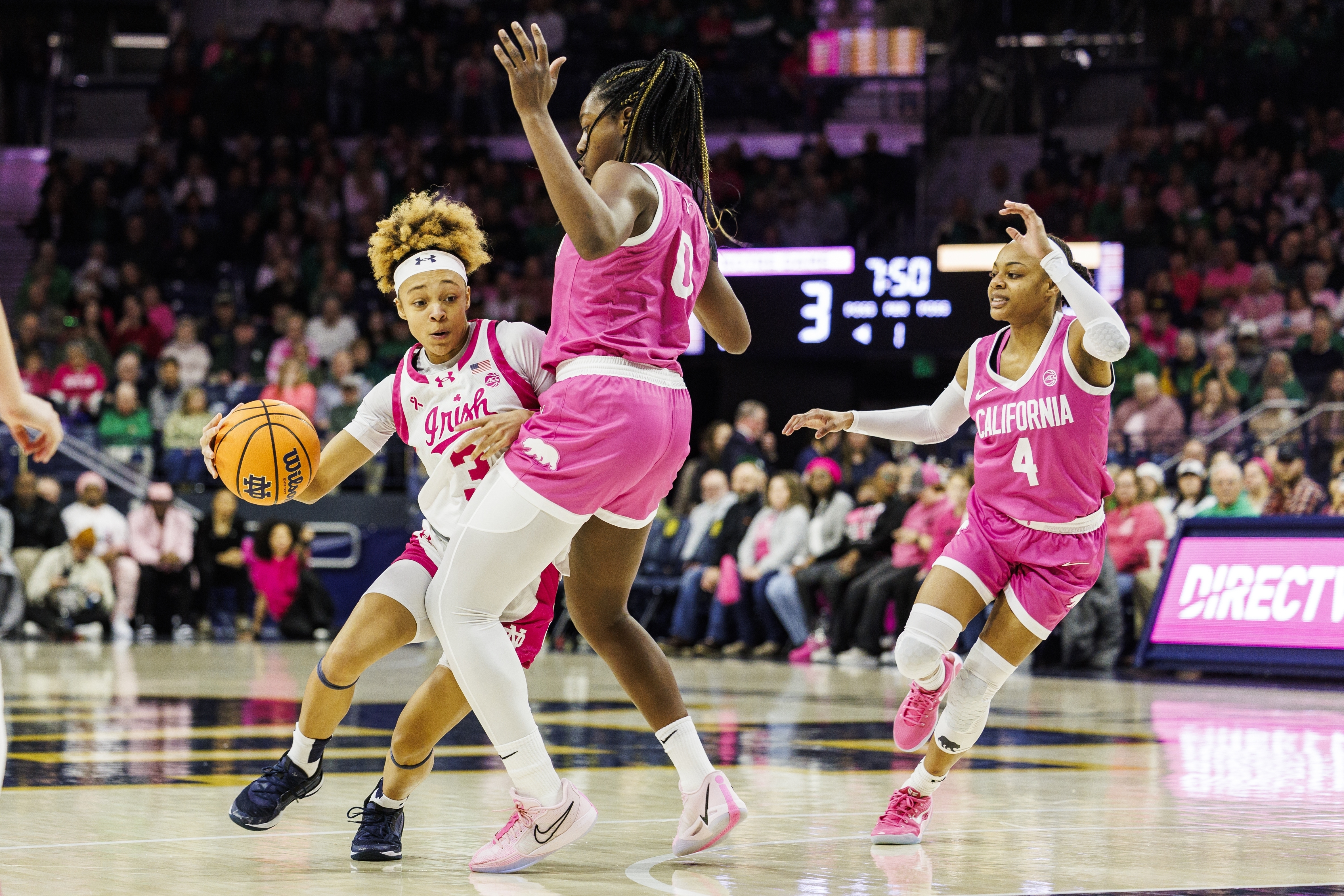 Notre Dame guard Hannah Hidalgo (3) drives as California center Ugonne (Michelle) Onyiah (0) defends during the first half of an NCAA college basketball game Sunday, Feb. 9, 2025, in South Bend, Ind.
