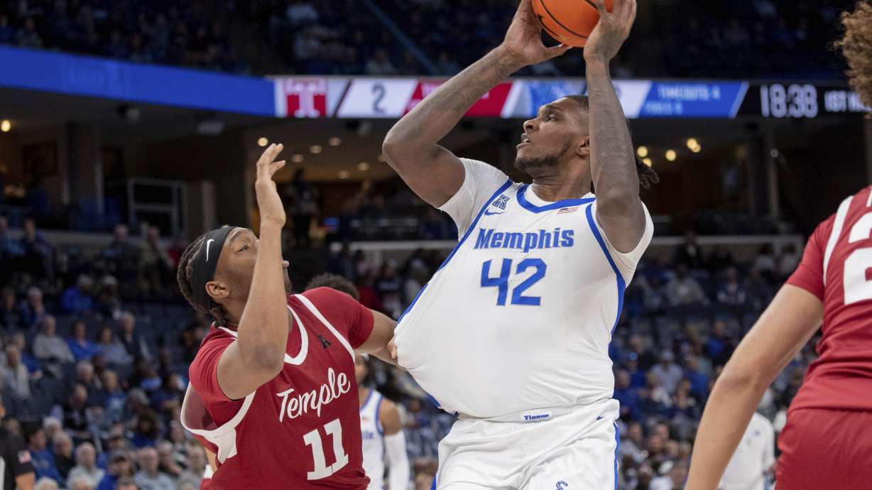 Temple forward Babatunde Durodola (11) defends against Memphis forward Dain Dainja (42) during the first half of an NCAA college basketball game Sunday, Feb. 9, 2025, in Memphis, Tenn.
