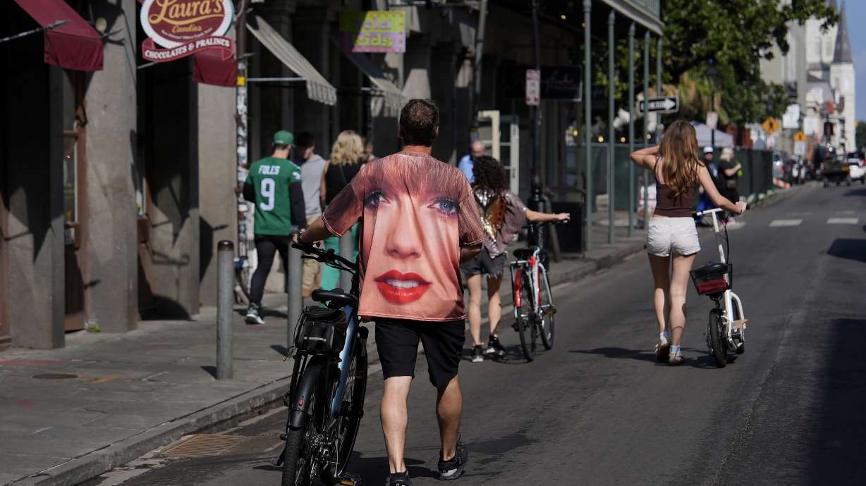 A person wearing a Taylor Swift shirt walks in the French Quarter before the NFL Super Bowl 59 football game between the Kansas City Chiefs and the Philadelphia Eagles, Sunday, Feb. 9, 2025, in New Orleans.
