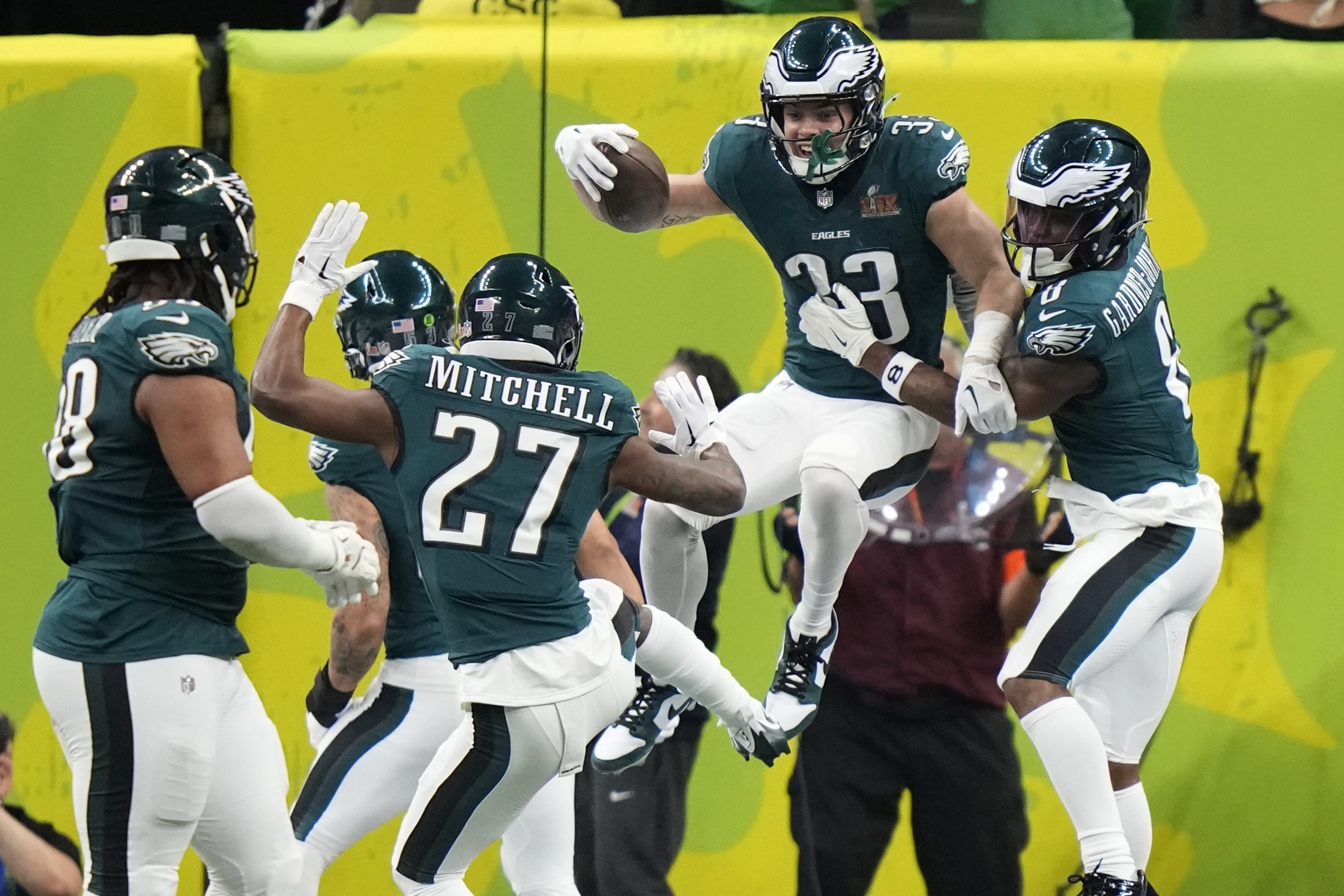 Philadelphia Eagles defensive back Cooper DeJean (33) celebrate his touchdown with safety C.J. Gardner-Johnson (8) after an interception against the Kansas City Chiefs during the first half of the NFL Super Bowl 59 football game, Sunday, Feb. 9, 2025, in New Orleans.