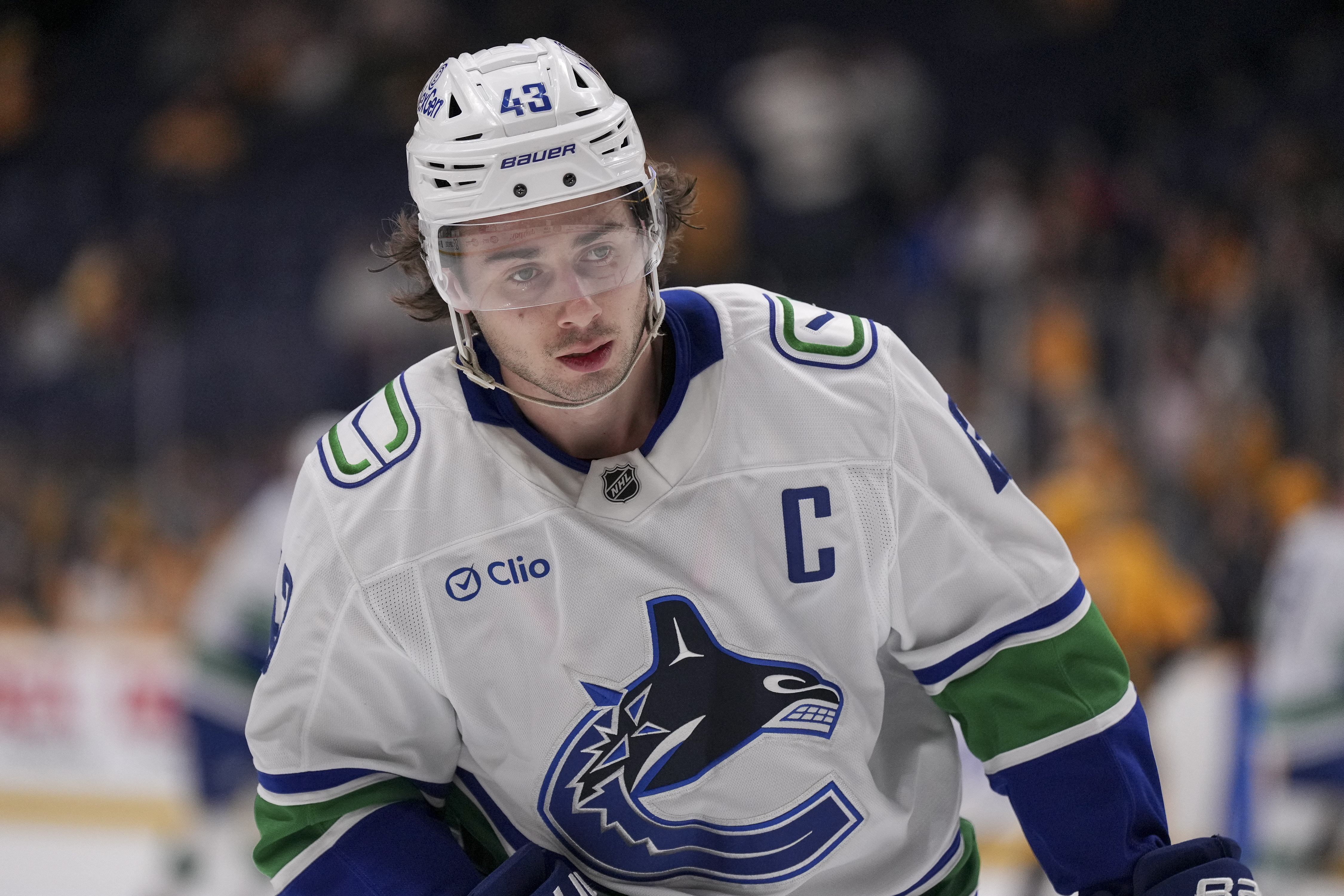 Vancouver Canucks defenseman Quinn Hughes (43) warms up for the team's NHL hockey game against the Nashville Predators, Wednesday, Jan. 29, 2025, in Nashville, Tenn.