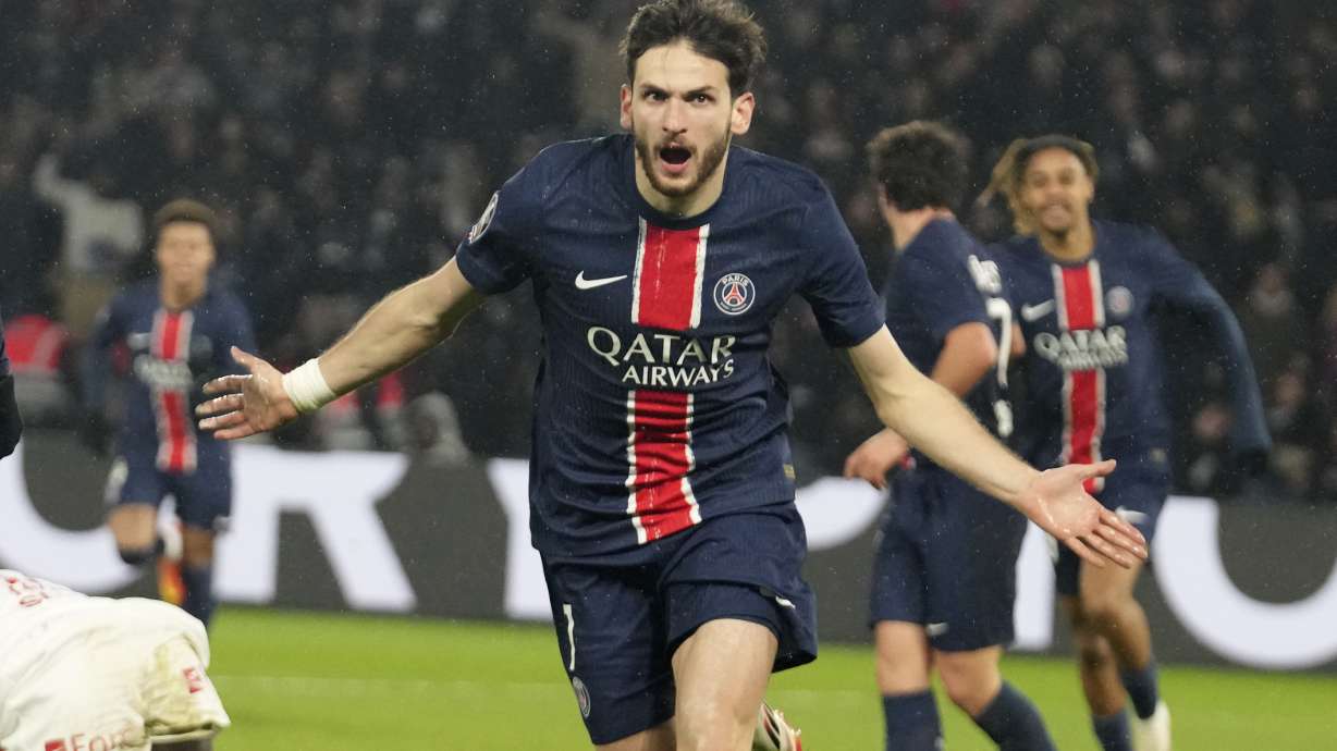 PSG's Khvicha Kvaratskhelia celebrates after scoring his sides second goal during the French League One soccer match between Paris Saint-Germain and Monaco at Parc des Princes stadium in Paris, Friday, Feb. 7, 2025.